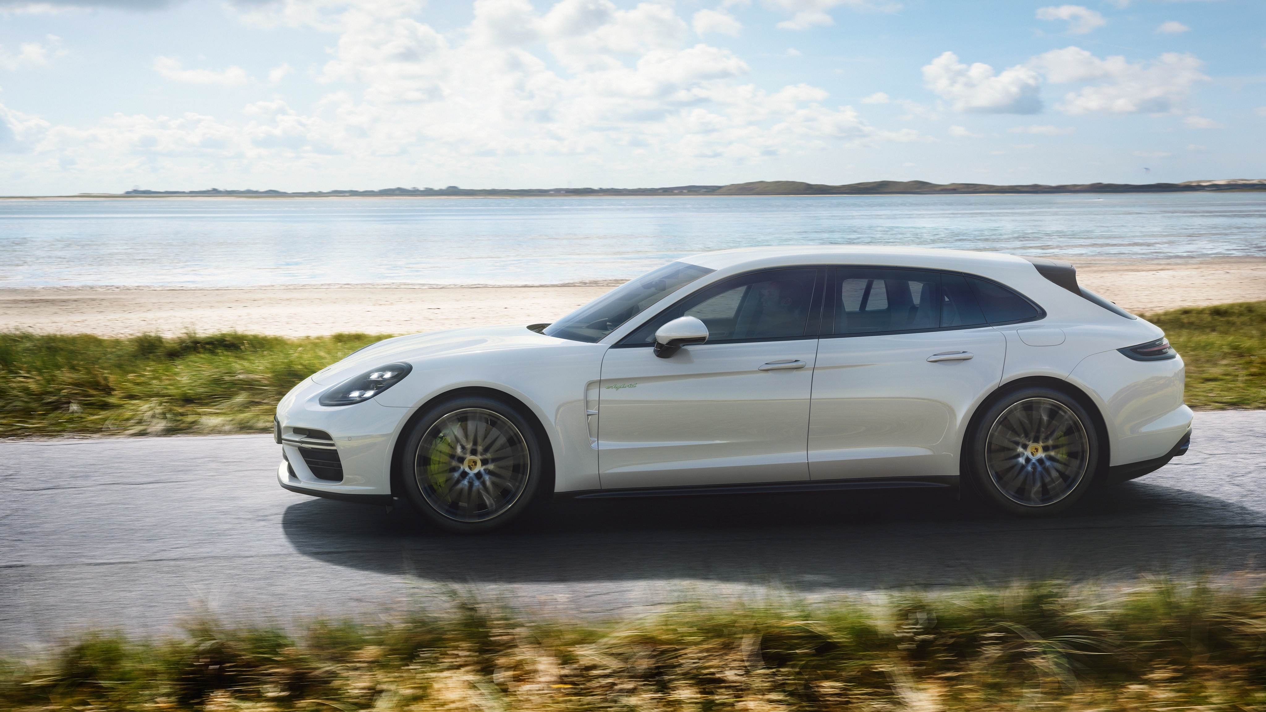 White Porsche Panamera Turbo S E-Hybrid Sport Turismo on road HD Wallpaper