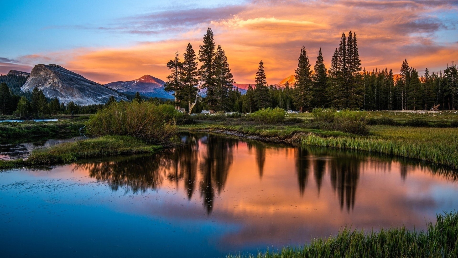 Sunset over a mountain lake with pine trees HD Wallpaper