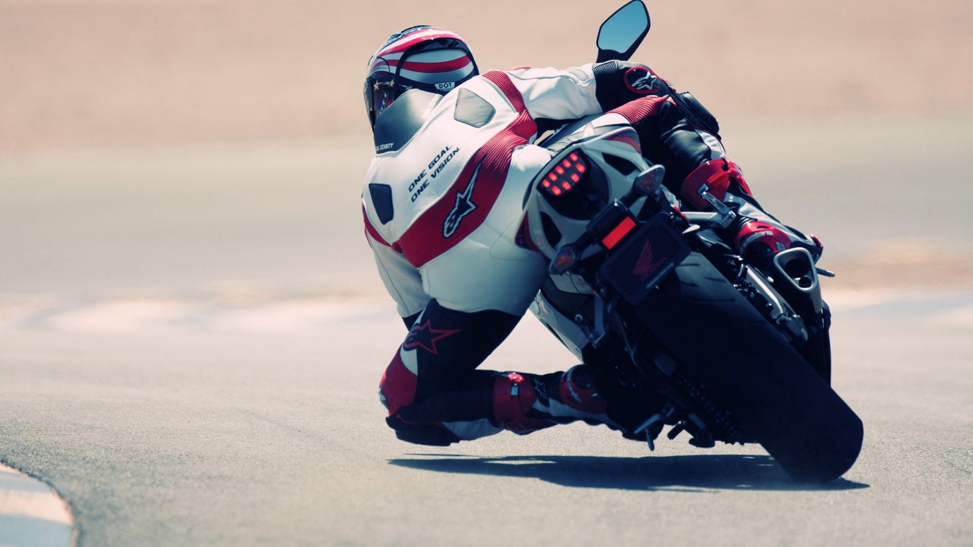 Motorcycle racer in white and red suit on Honda motorcycle HD Wallpaper
