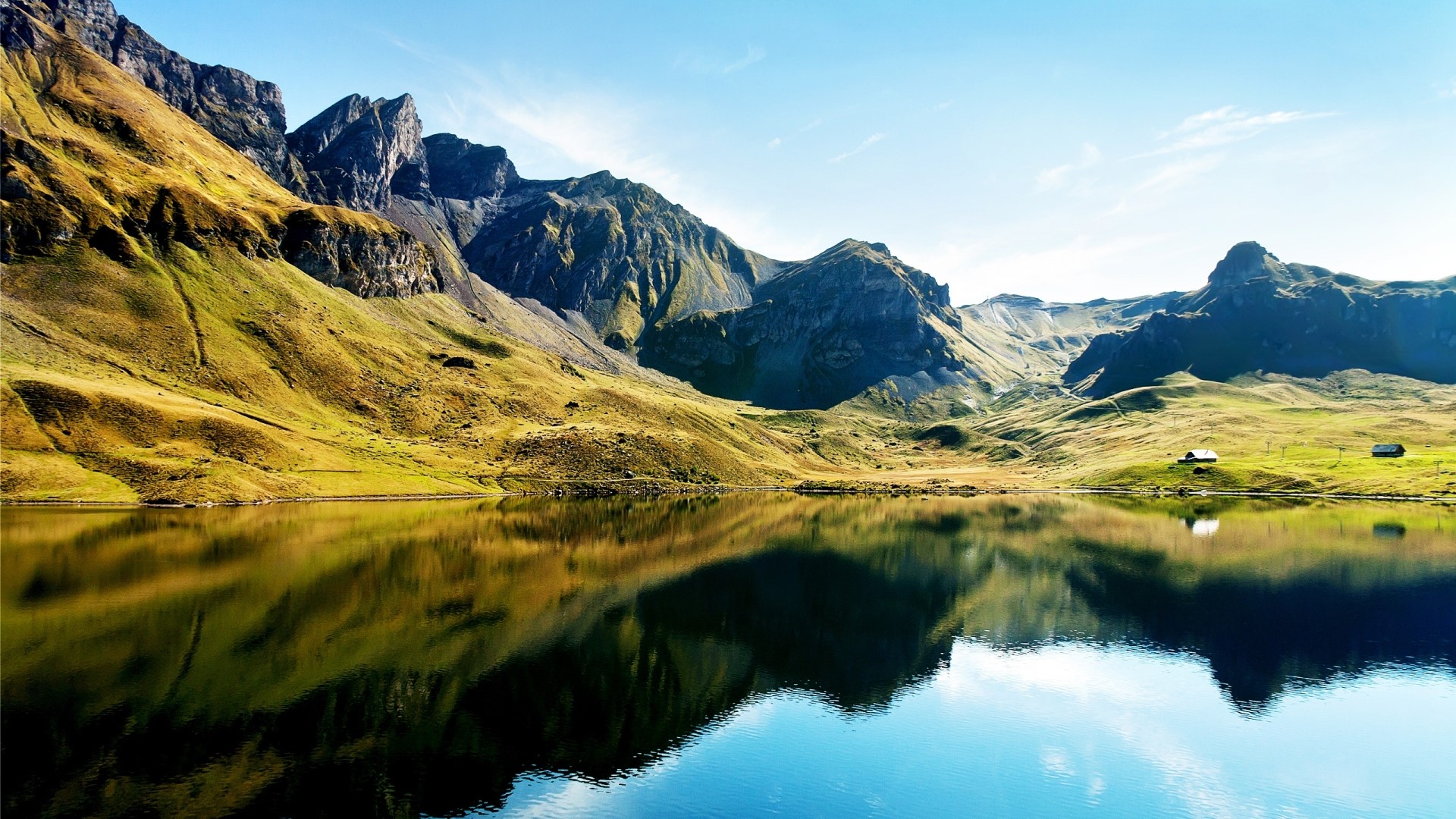 Lake reflecting mountains in the Swiss Alps HD Wallpaper