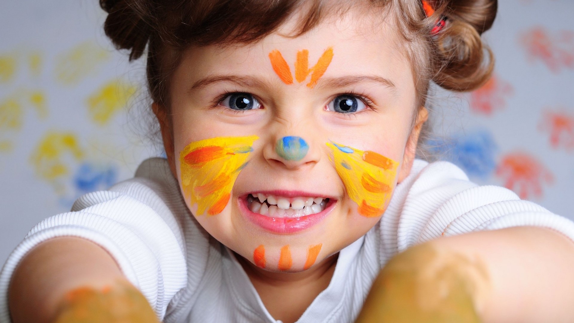 Cute girl with face paint smiling HD Wallpaper