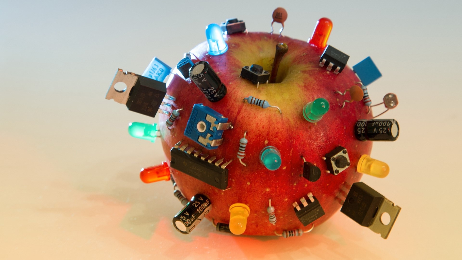 Apple with Computer Electronics and LEDs HD Wallpaper