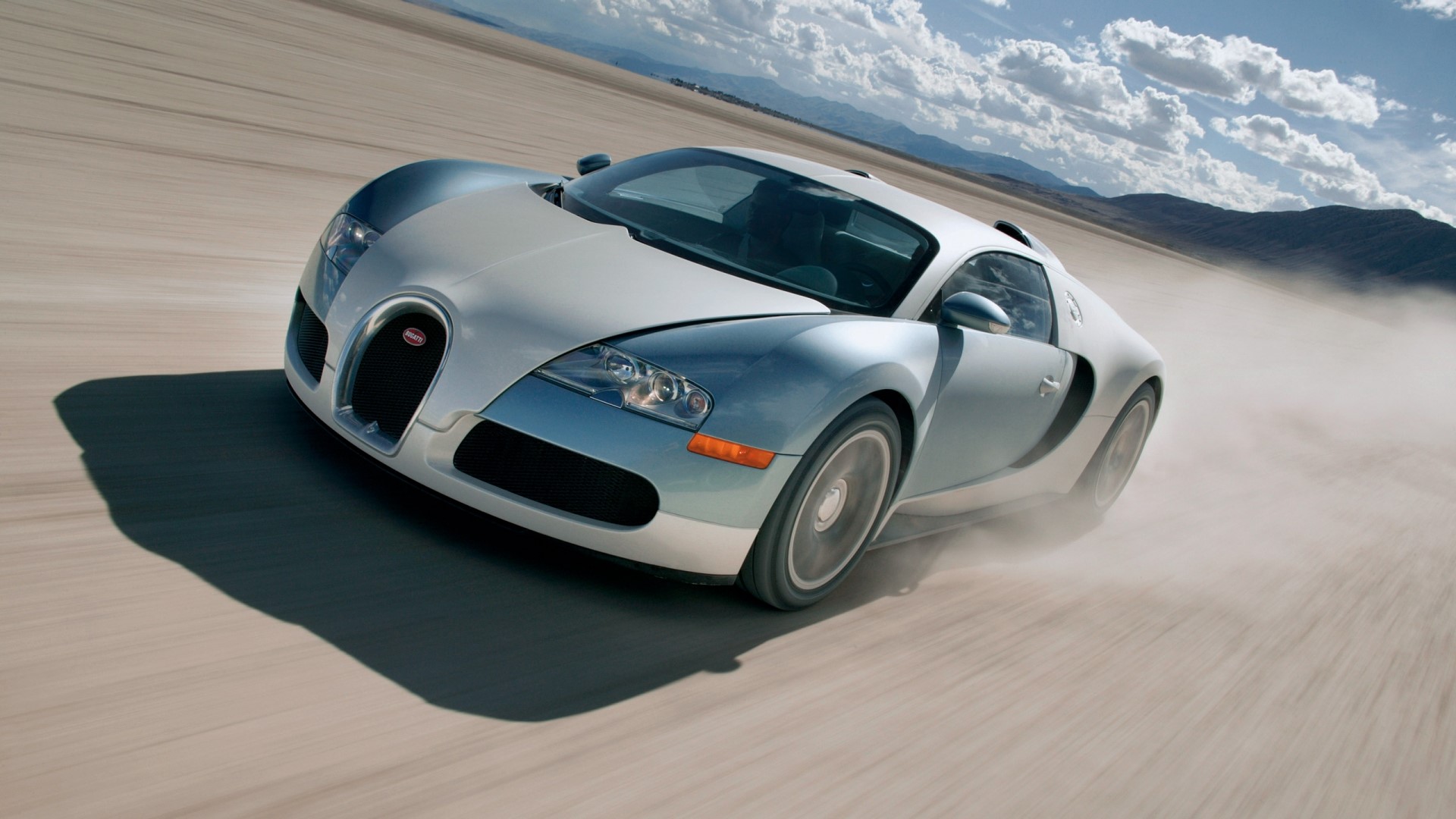 Bugatti Veyron driving on a dirt road HD Wallpaper