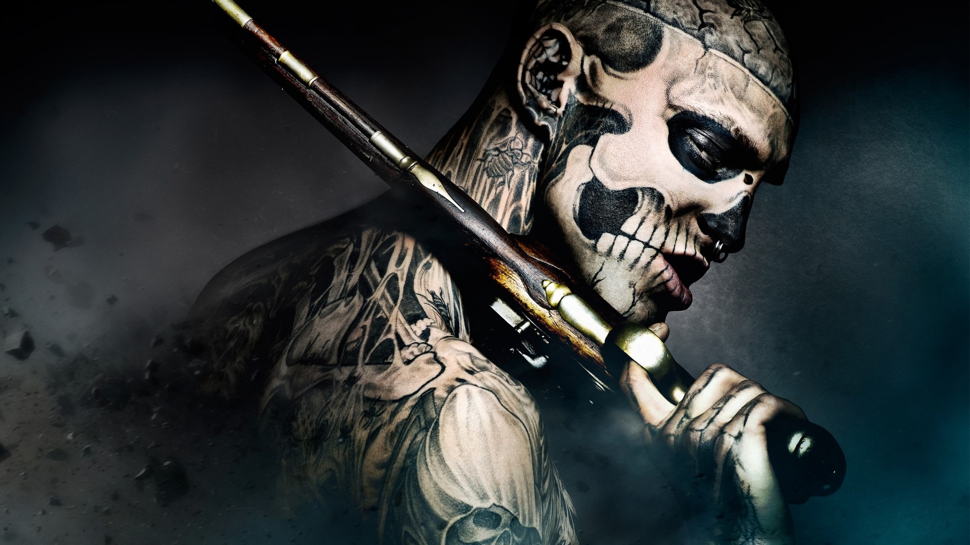 Man with skull face paint and tattoos holding a rifle HD Wallpaper