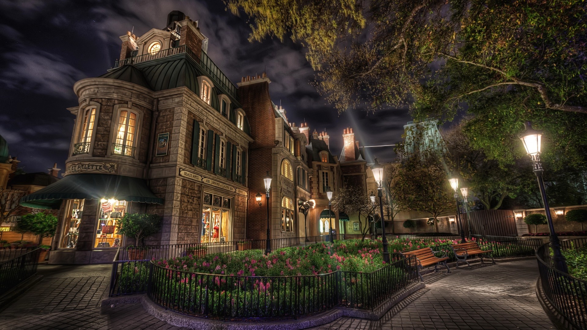 French-style building at night with flower beds HD Wallpaper