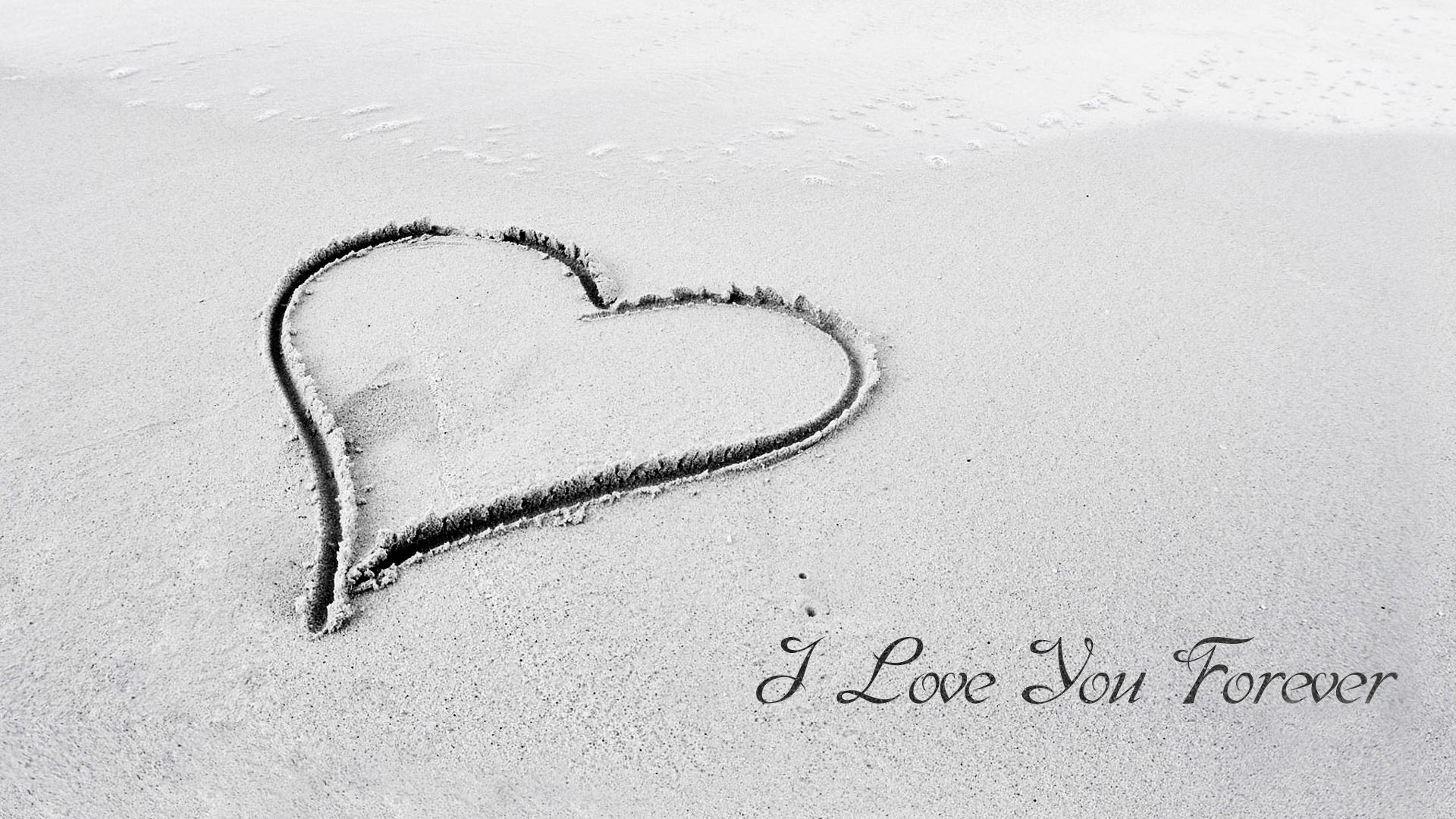 Heart drawn in sand with text HD Wallpaper