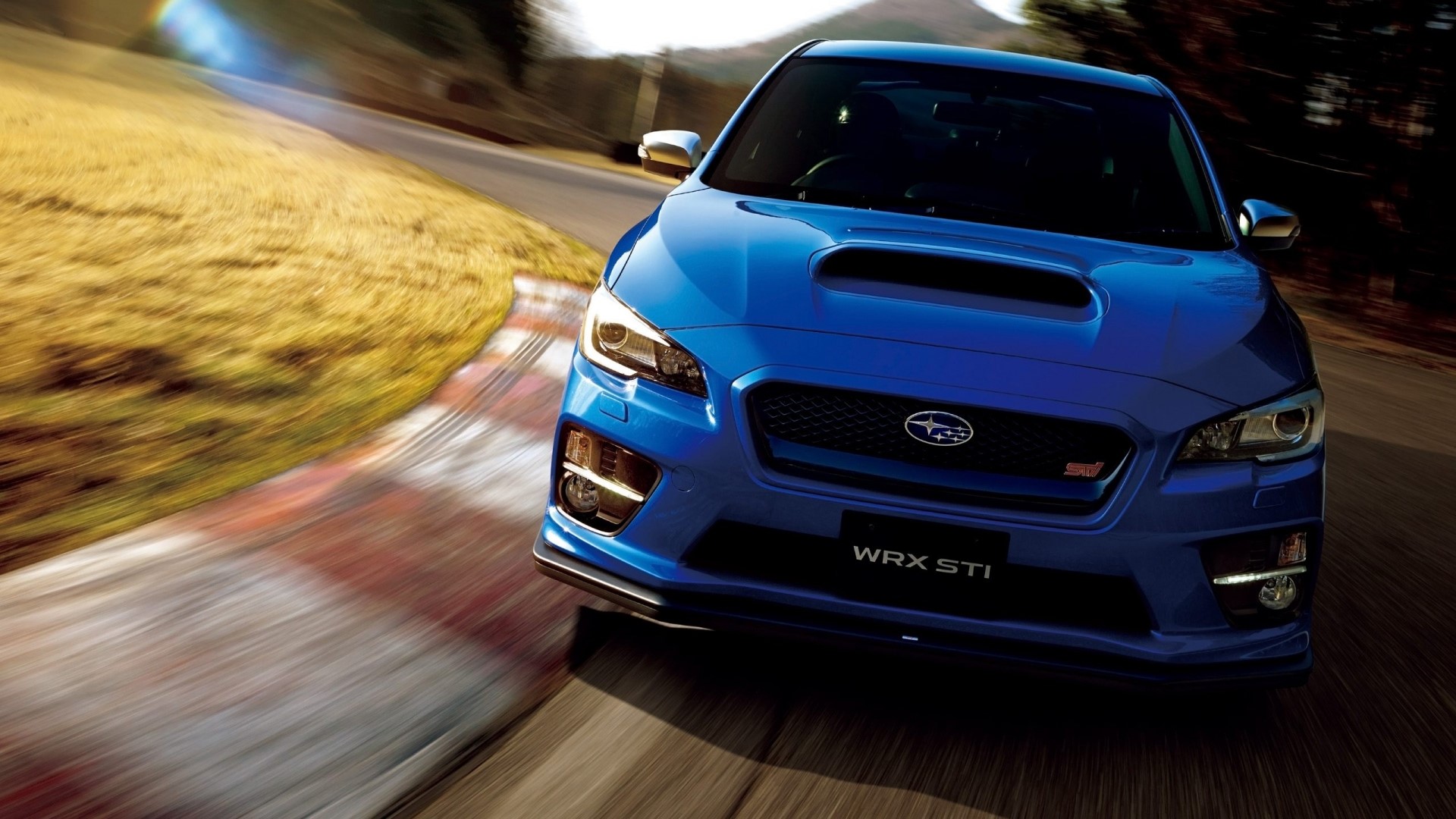Blue Subaru WRX STI on a race track HD Wallpaper