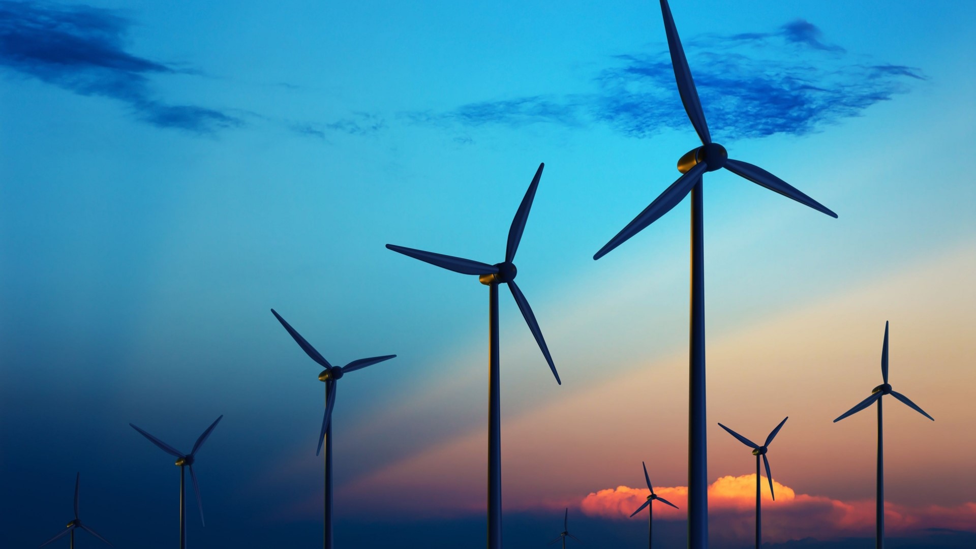 Wind turbines against a colorful sunset sky HD Wallpaper
