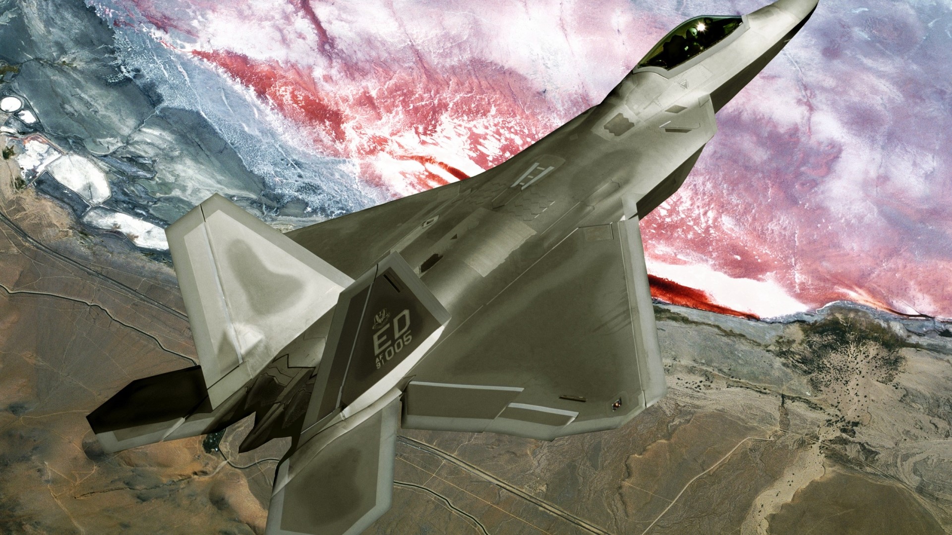 F-22 Raptor Jet Flying Over Desert Landscape HD Wallpaper