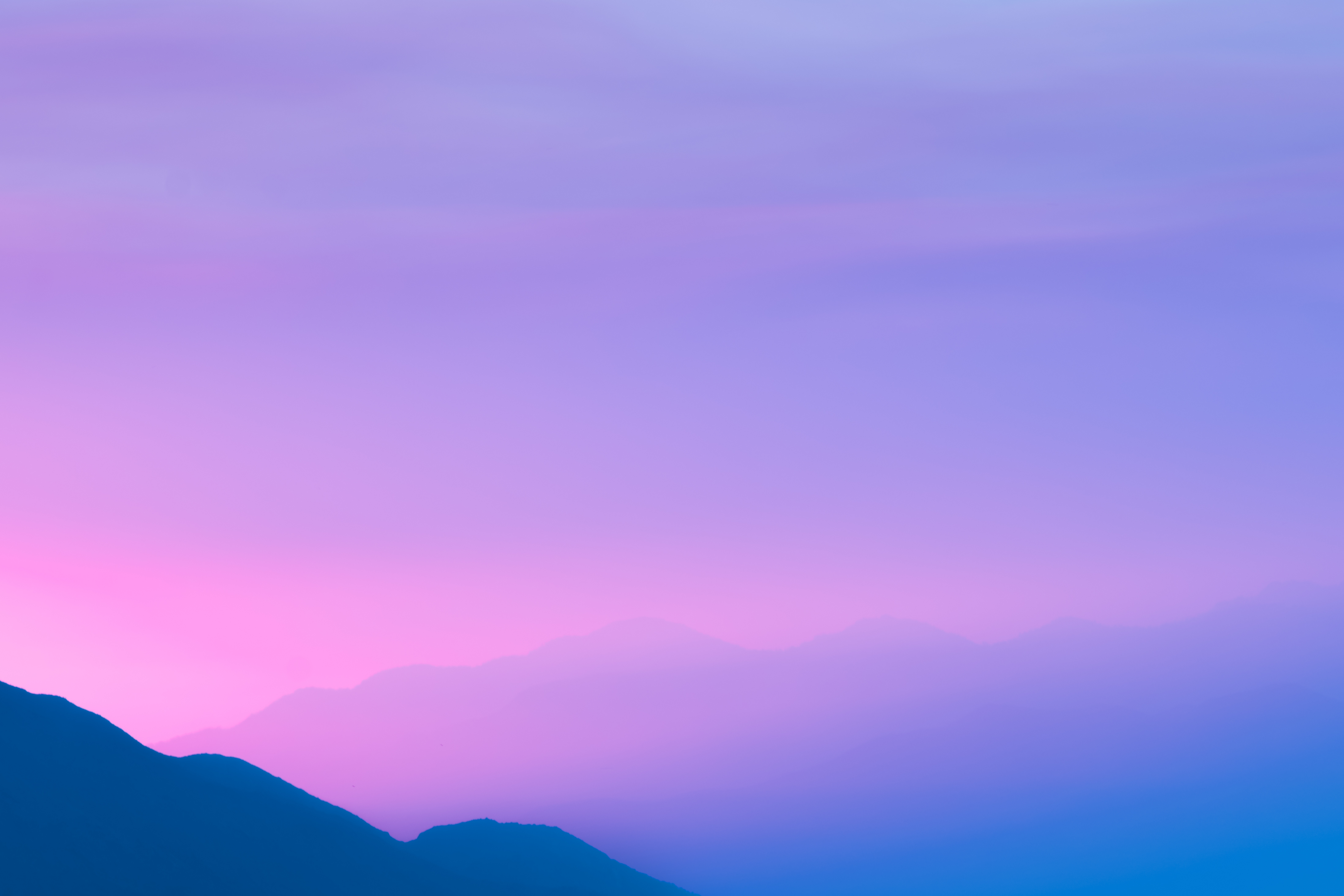 Purple sky over foggy mountains at sunset HD Wallpaper