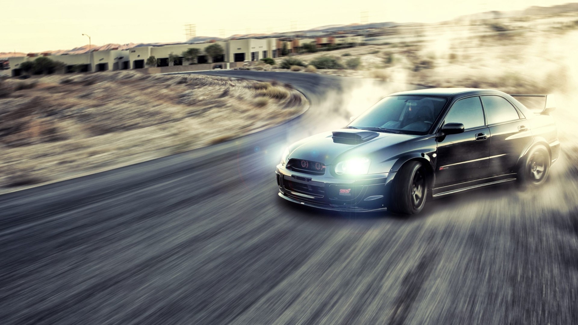Black Subaru Impreza WRX STI drifting on a road HD Wallpaper