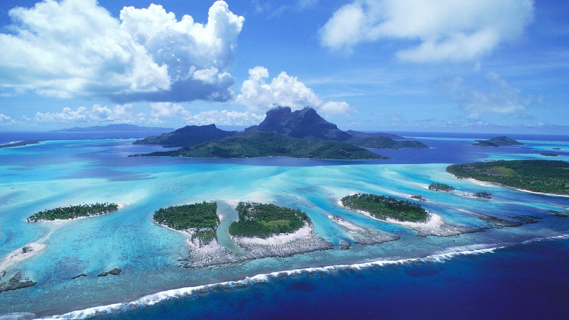 Bora Bora Island aerial view with mountains and turquoise water HD Wallpaper