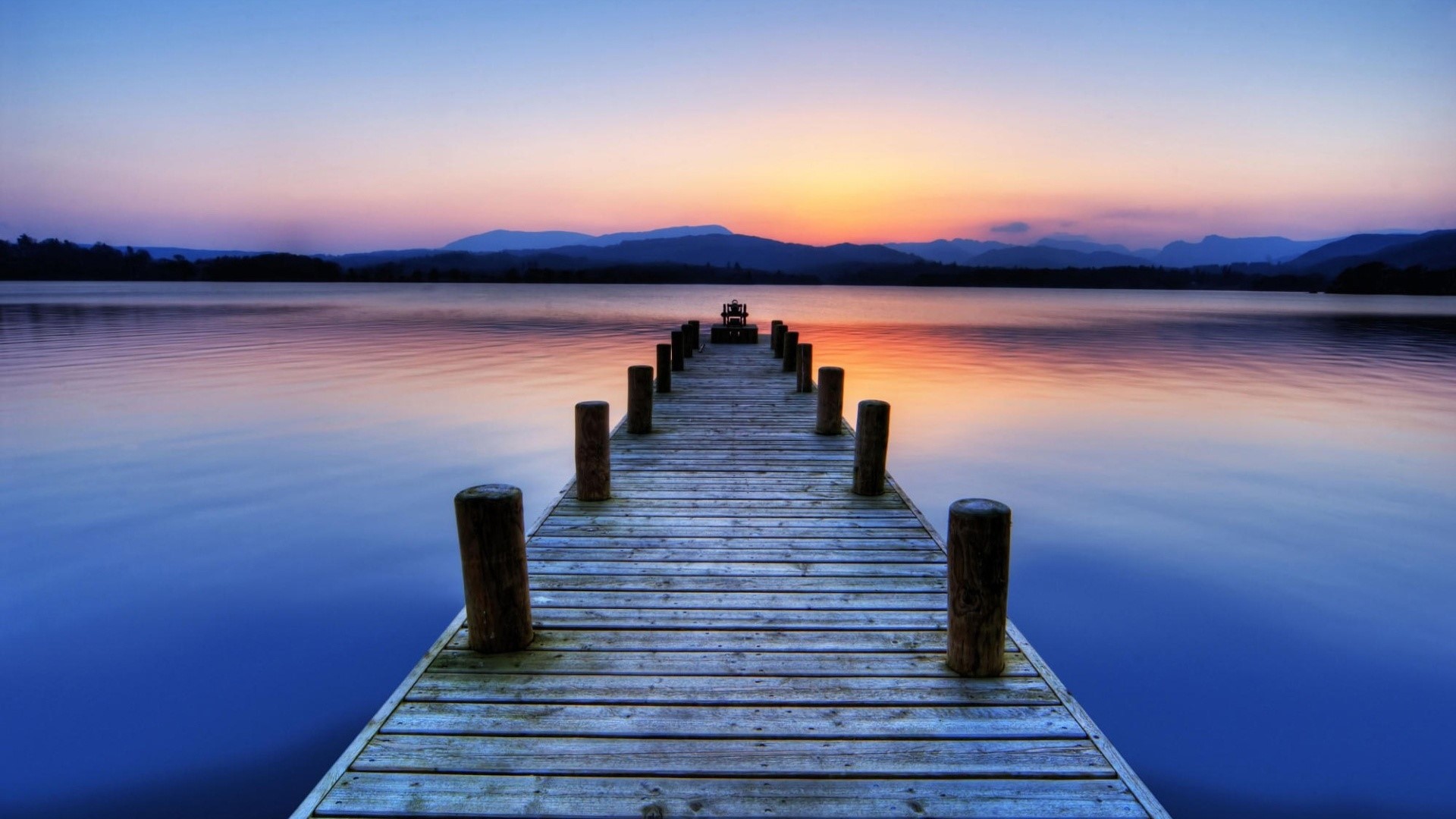 Wooden pier on a lake at sunset HD Wallpaper