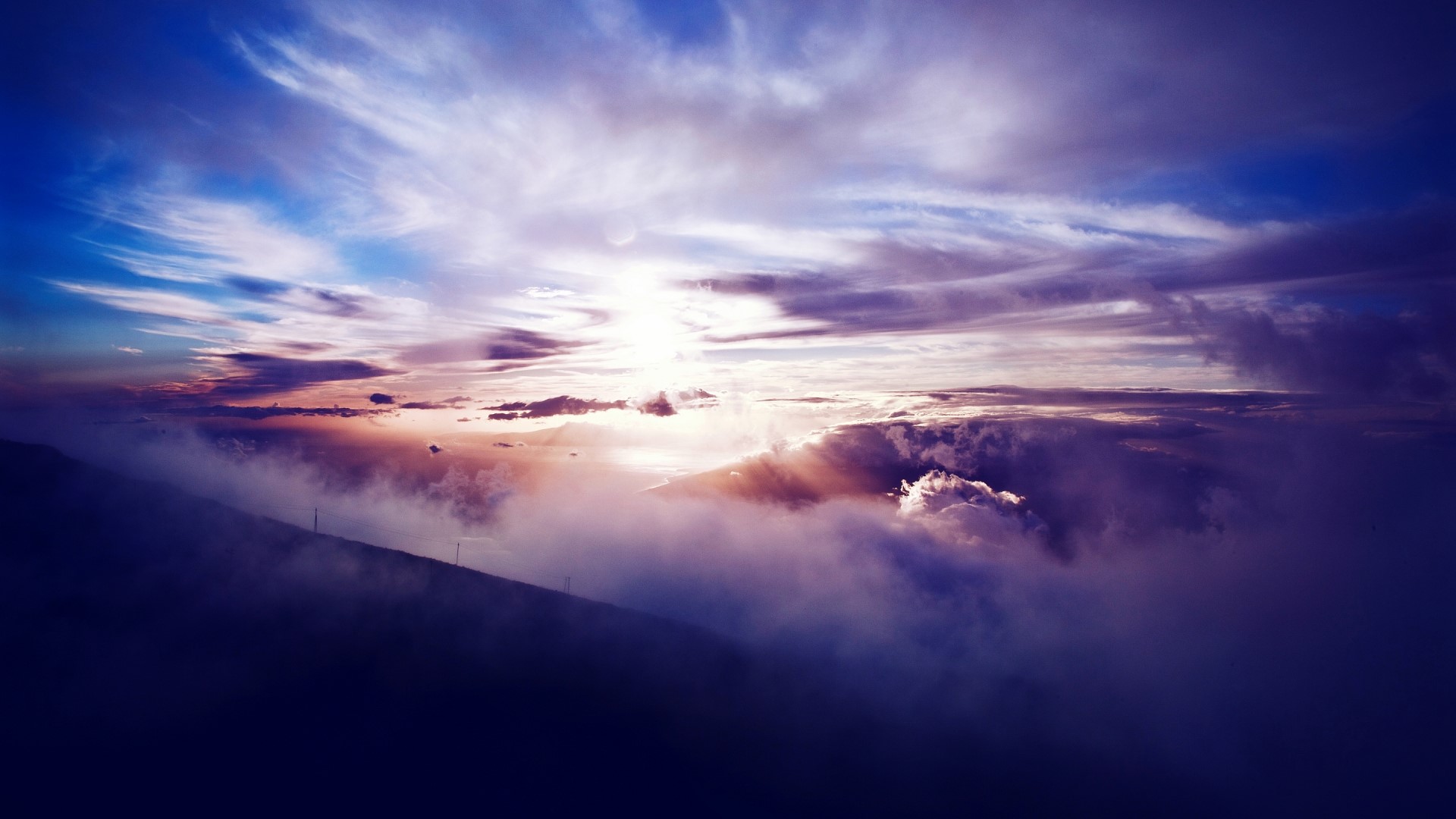 Sunrise over Haleakala National Park with clouds HD Wallpaper