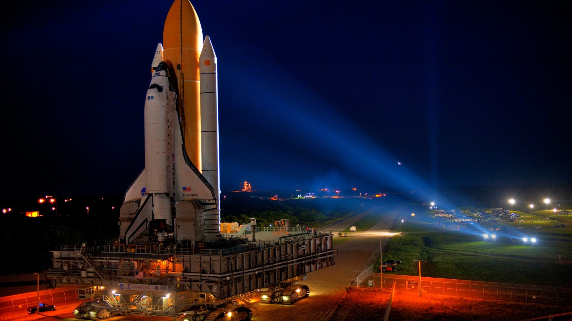 Space Shuttle Discovery on launchpad at night HD Wallpaper