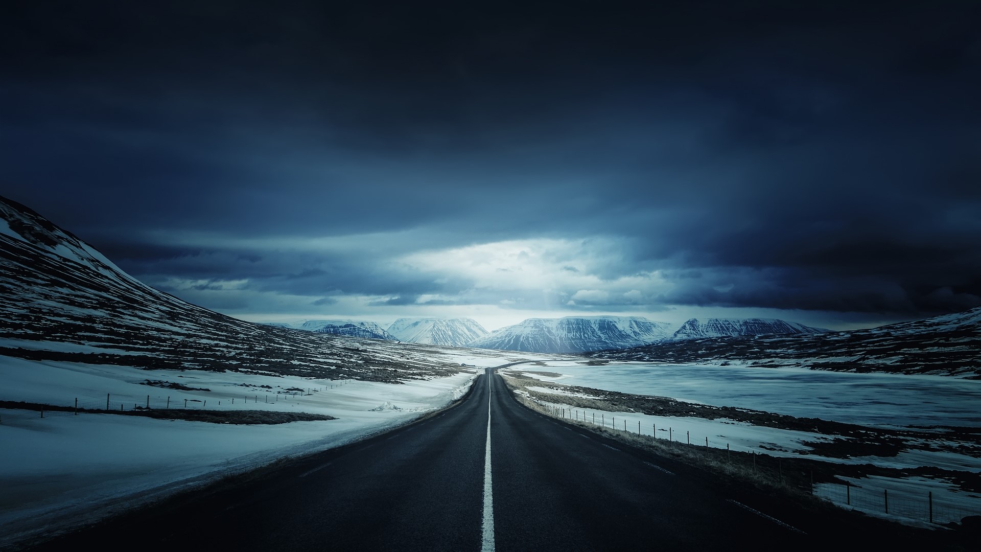 Iceland's Ring Road under stormy skies HD Wallpaper