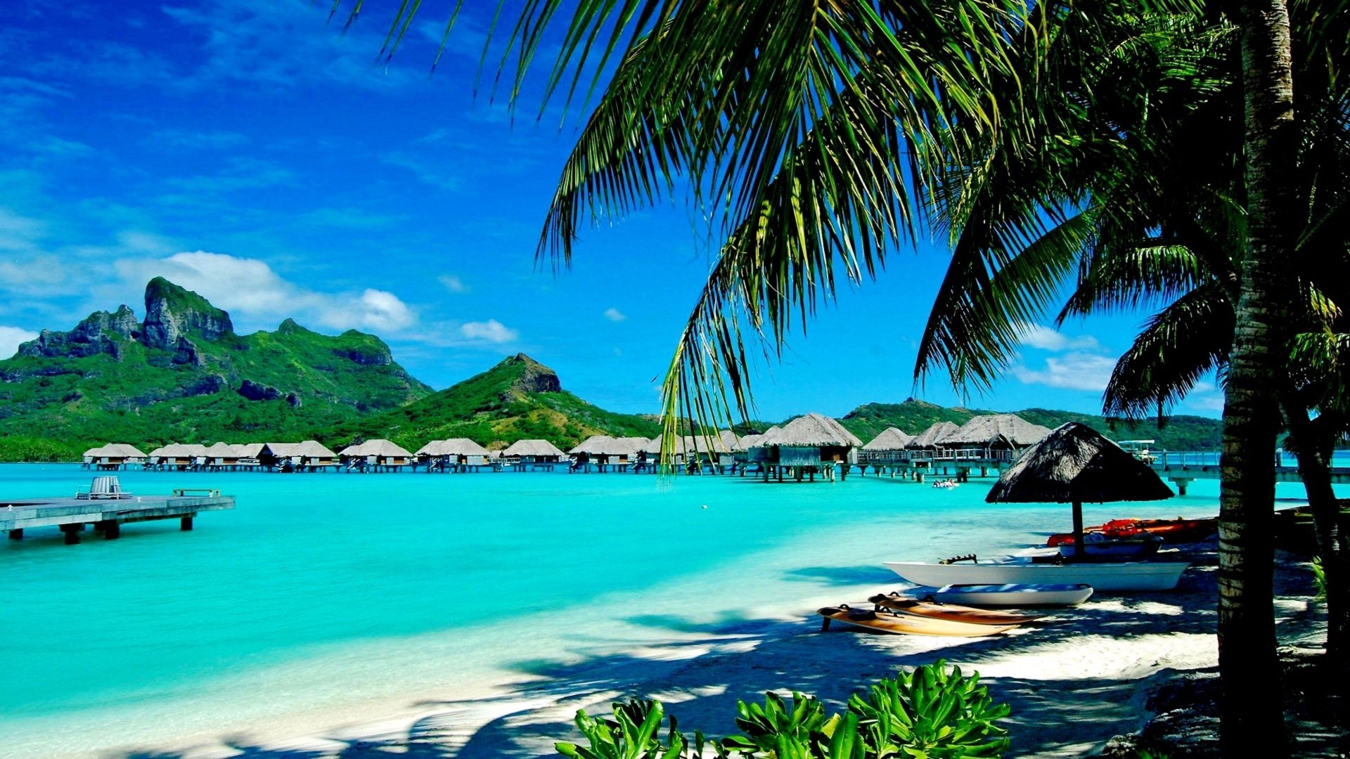Tropical Overwater Bungalows and Mountains HD Wallpaper