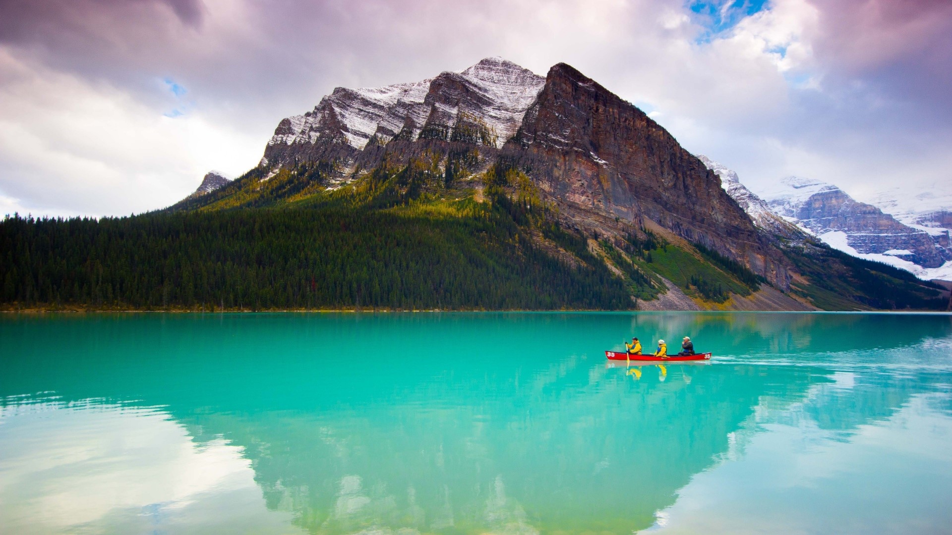 Canoeists on Lake Louise with Mountains HD Wallpaper