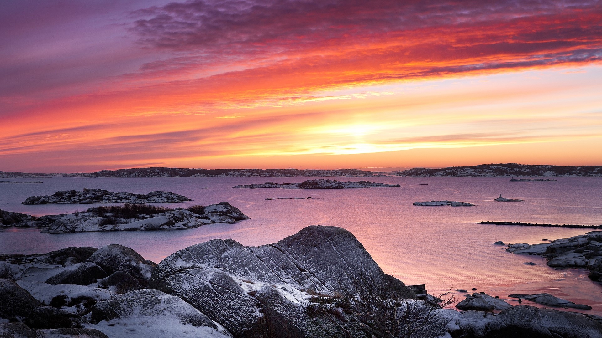 Sunset over a snowy archipelago HD Wallpaper
