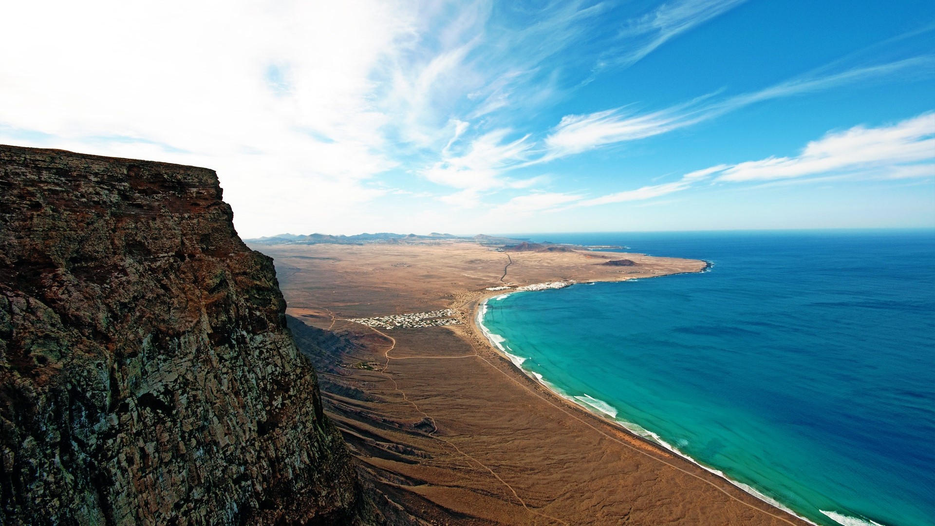 Cliff overlooking Lanzarote Island coast and ocean HD Wallpaper