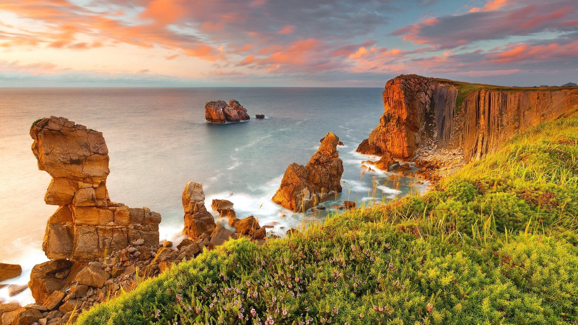 Rocky coast with sea stacks at sunset HD Wallpaper