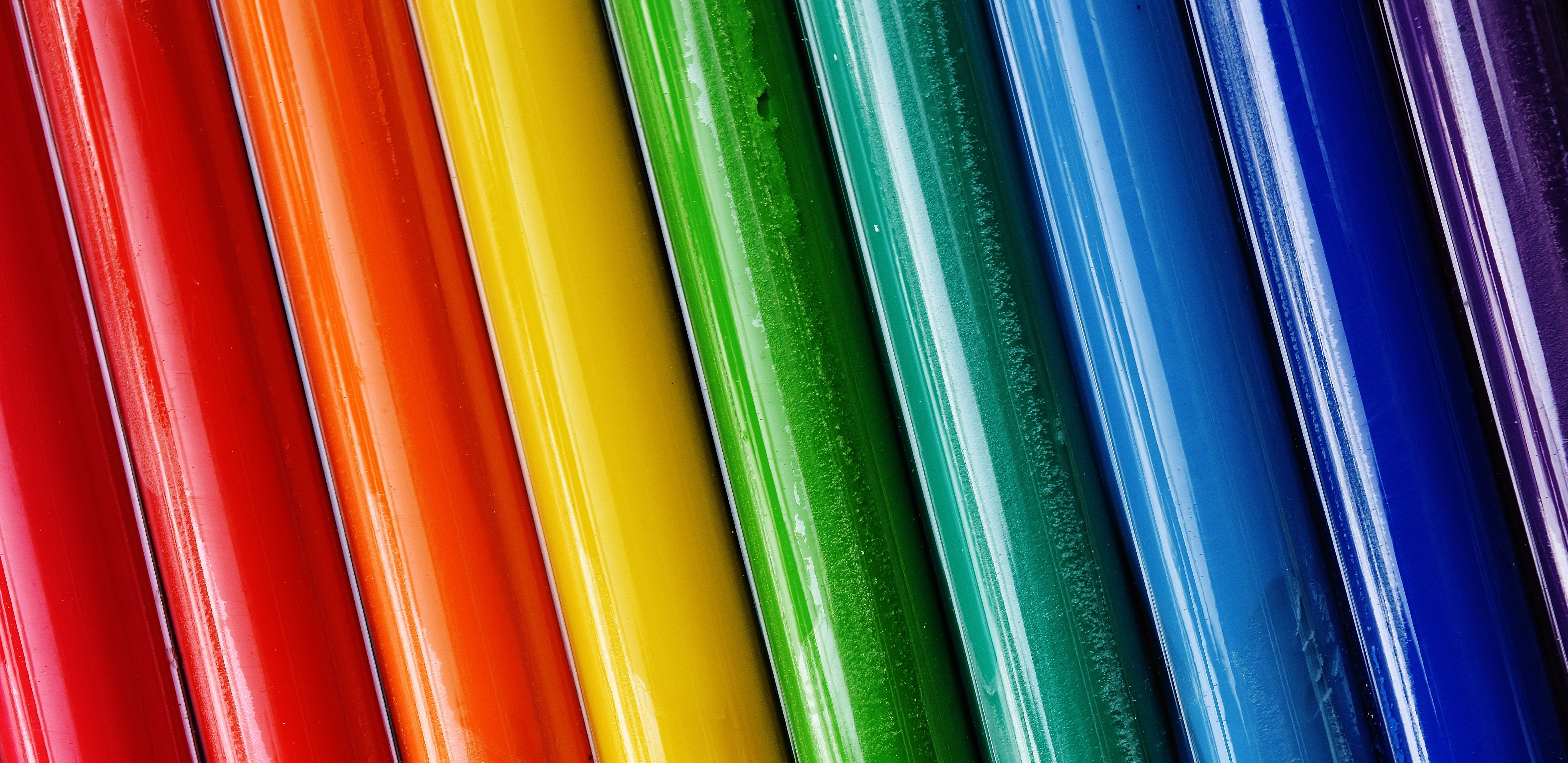 Colorful tubes arranged in a rainbow spectrum HD Wallpaper