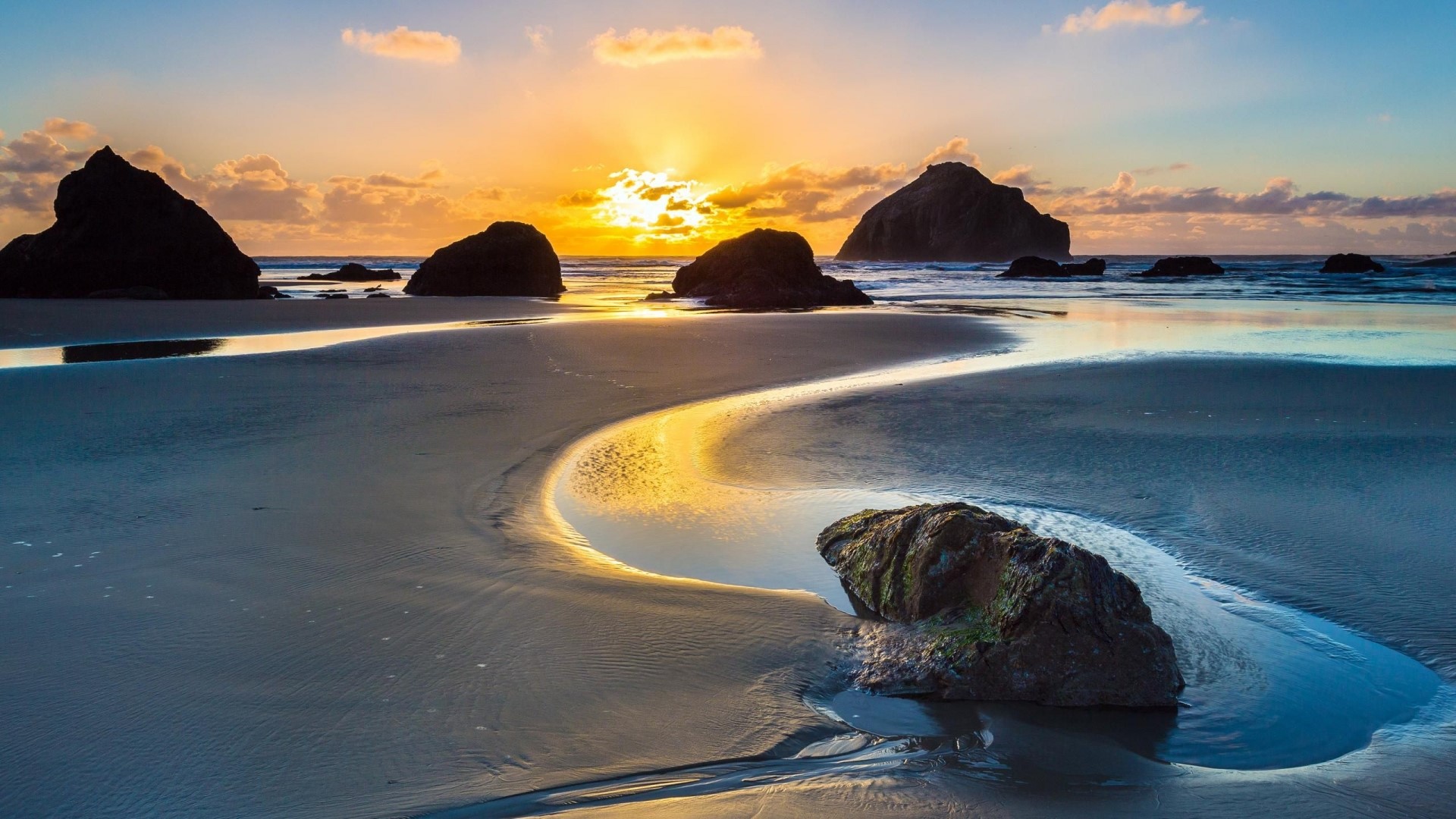 Sunset over a rocky beach with tide pools HD Wallpaper