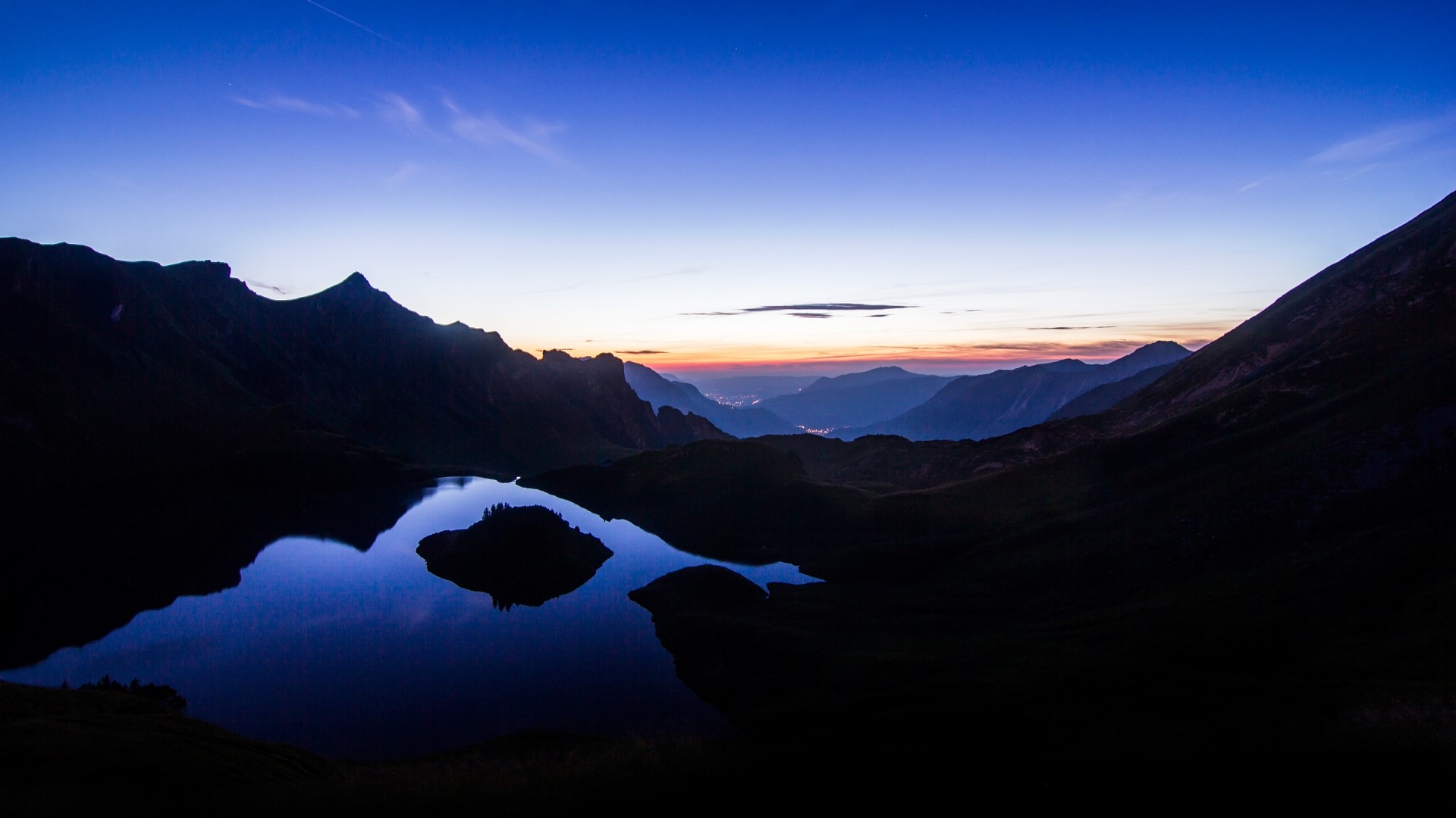 Mountain Lake at Dusk with Distant City Lights HD Wallpaper