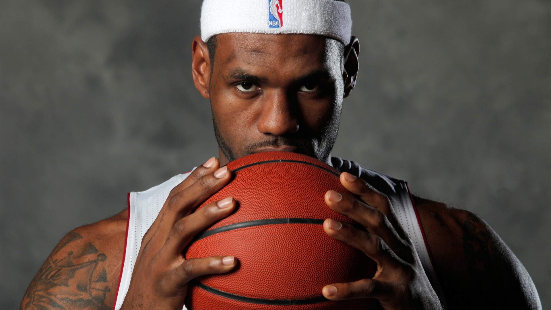 LeBron James holding a basketball HD Wallpaper