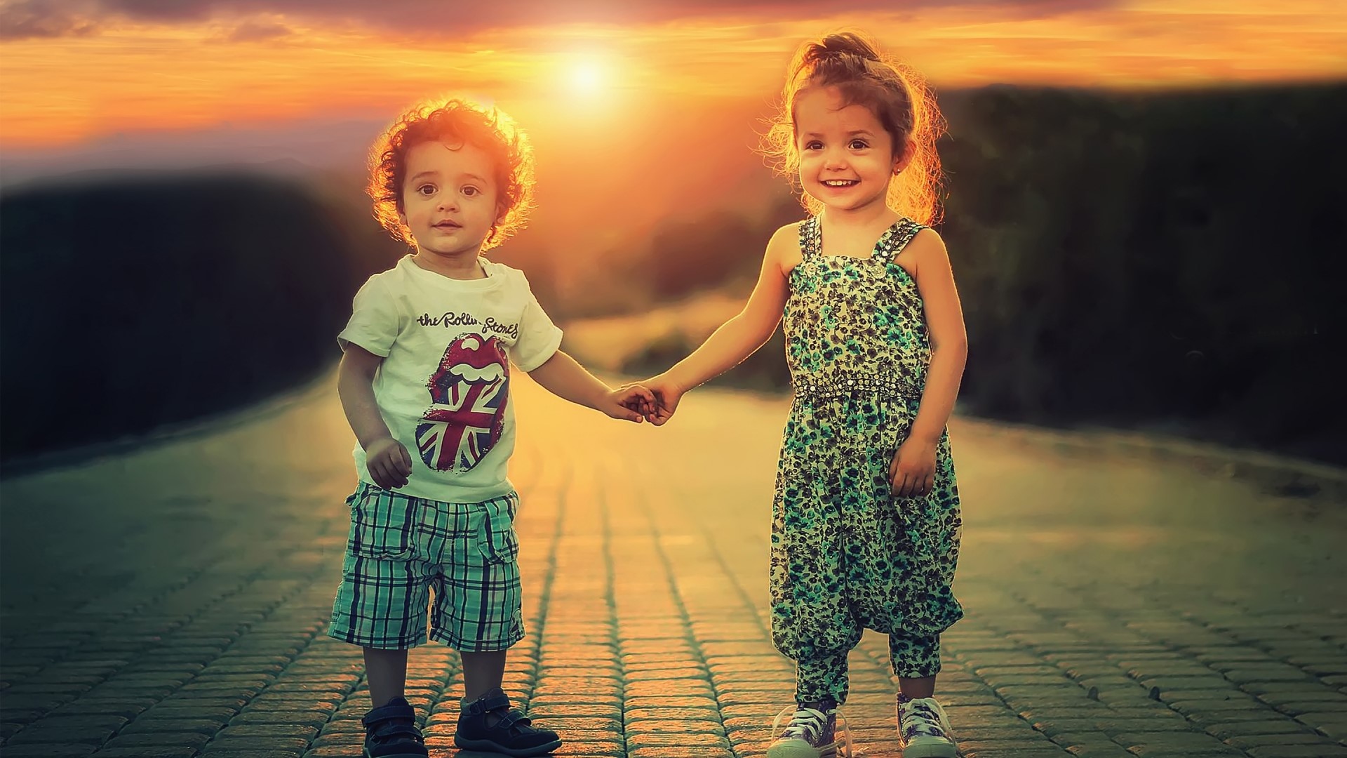 Children holding hands at sunset HD Wallpaper