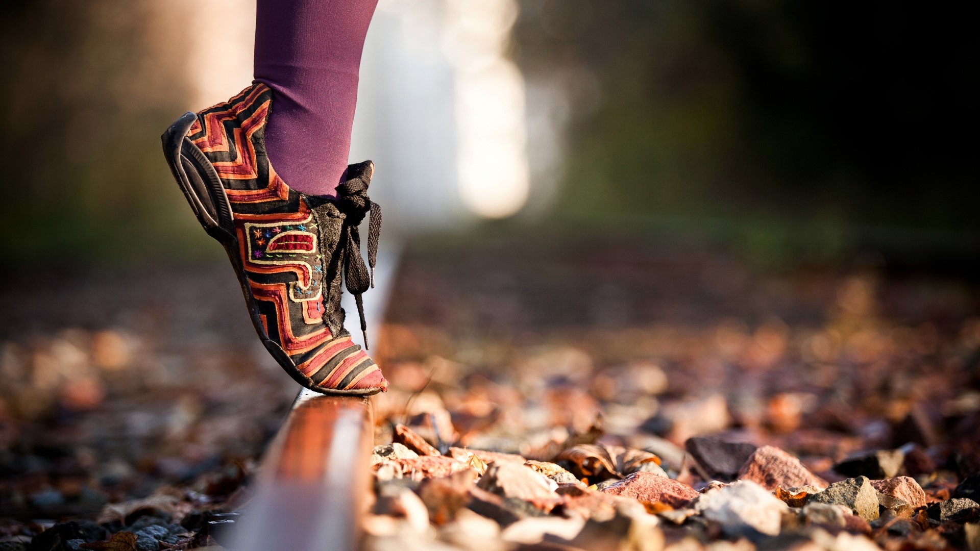 Person walking on railroad tracks HD Wallpaper