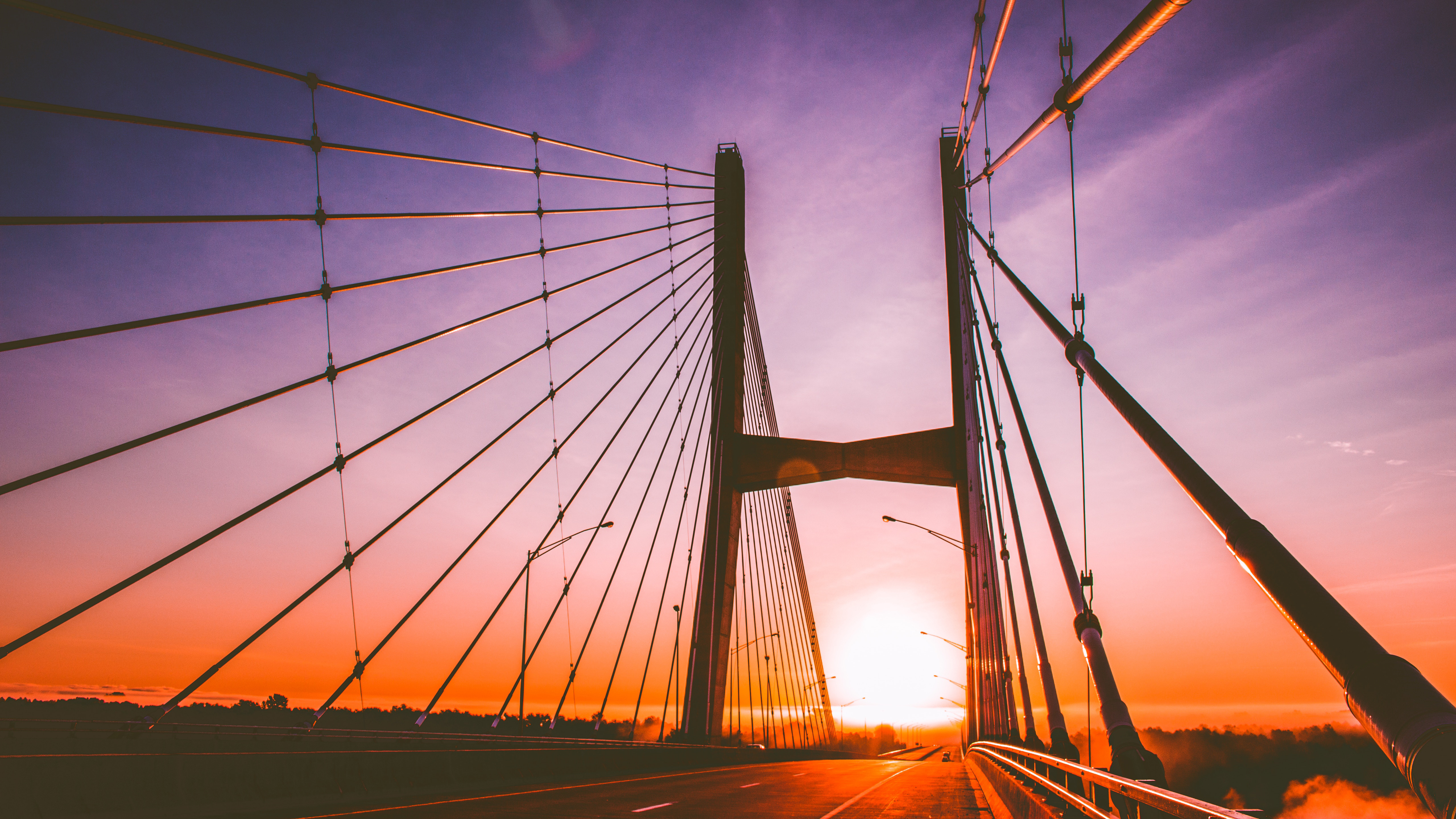 Cable-stayed bridge at sunset HD Wallpaper