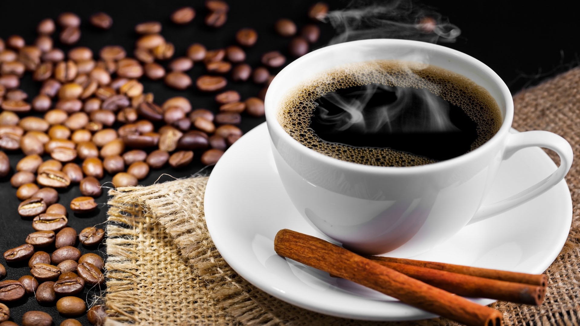 Hot Coffee Cup with Cinnamon Sticks and Beans HD Wallpaper