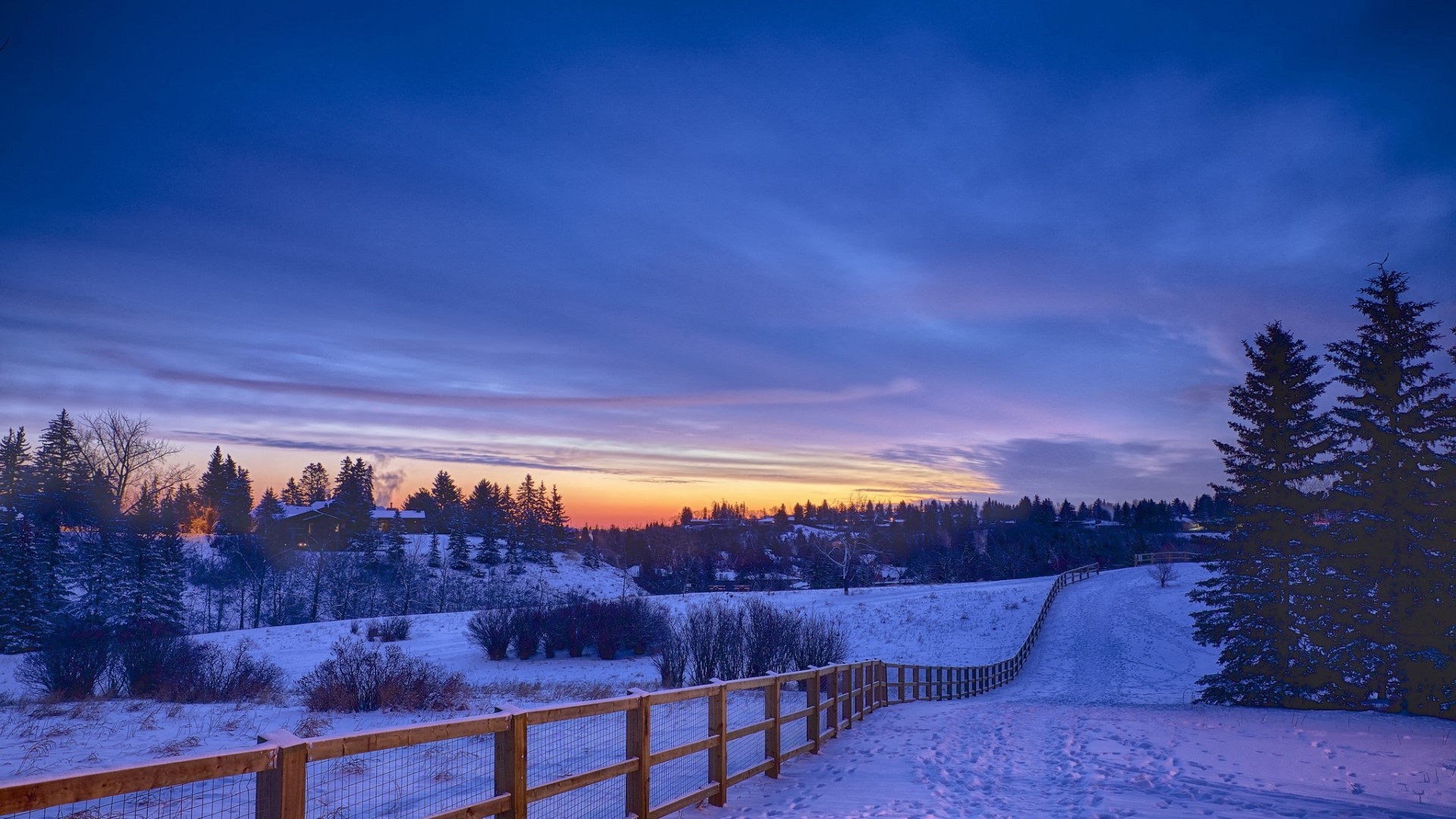 Snowy landscape at sunset with fence HD Wallpaper