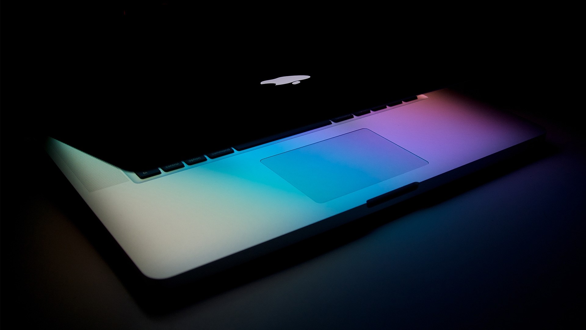 Macbook Pro with colorful lighting HD Wallpaper