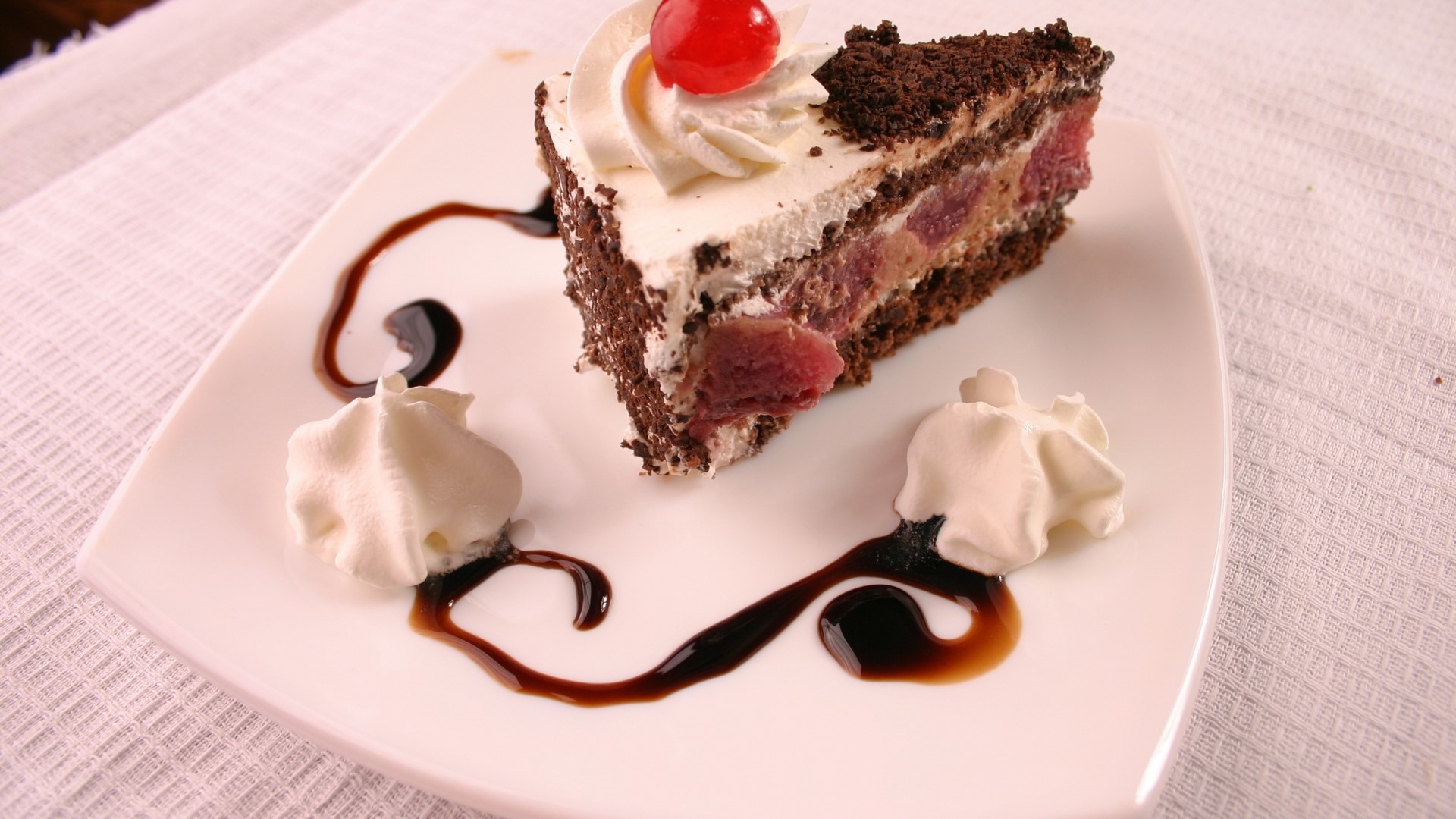 Chocolate cake with cream and cherries HD Wallpaper