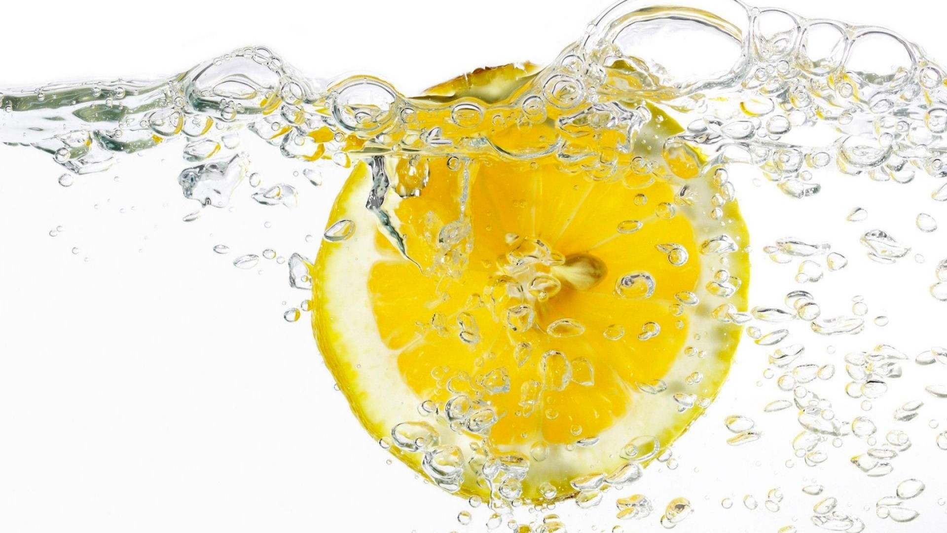 Lemon Slice Splashing in Water with Bubbles HD Wallpaper