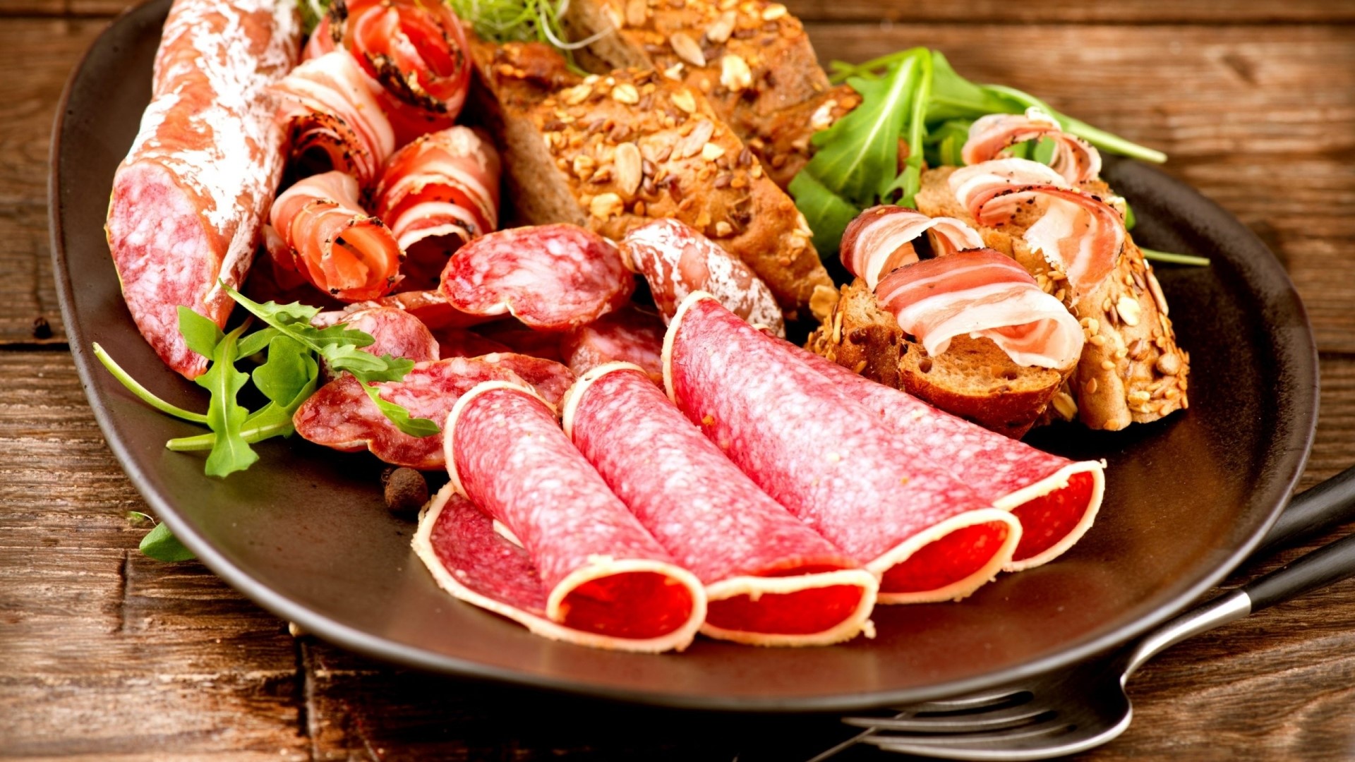 Charcuterie board with cured meats and bread HD Wallpaper