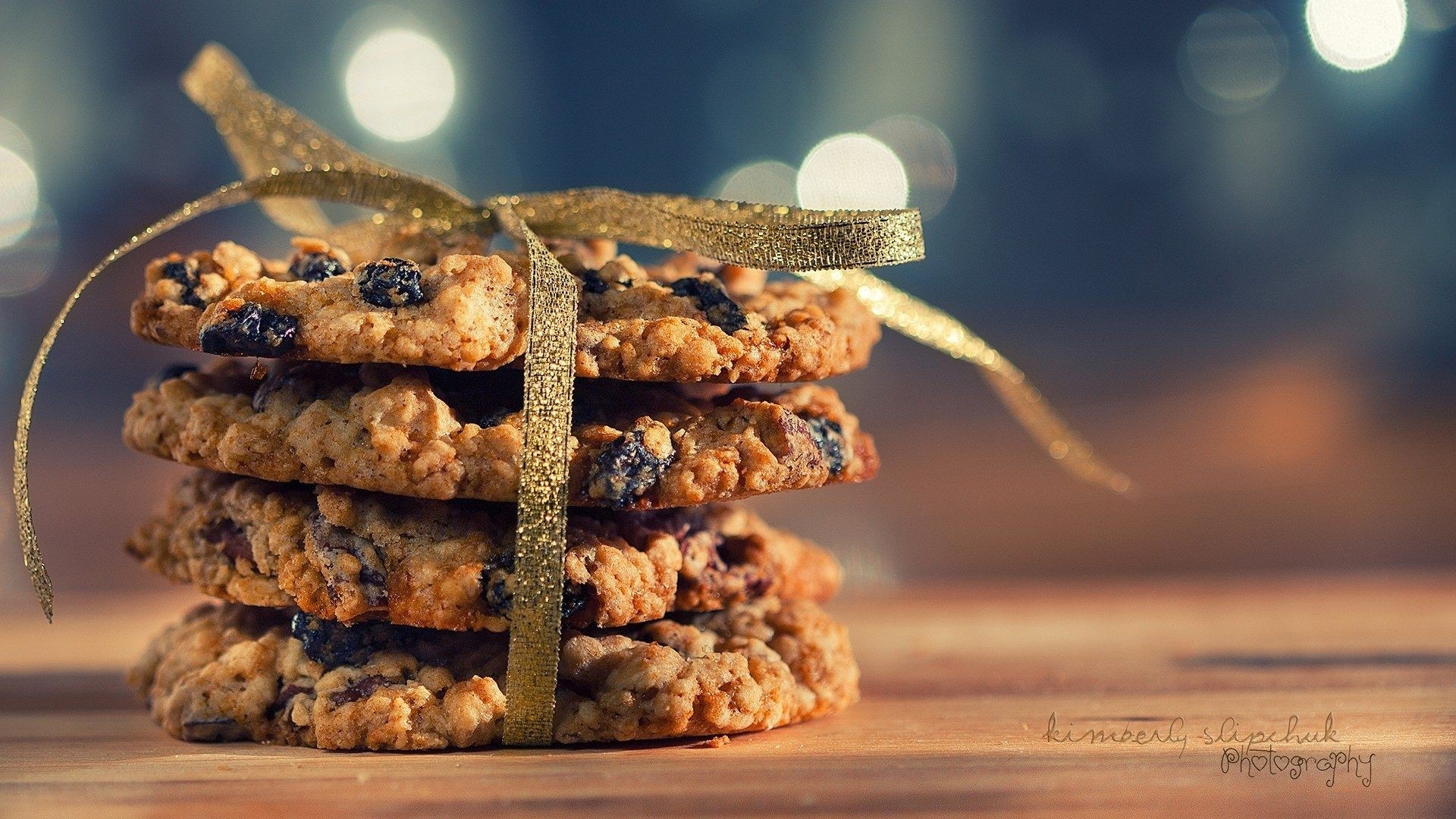 Stack of Oatmeal Raisin Cookies Tied with Gold Ribbon HD Wallpaper