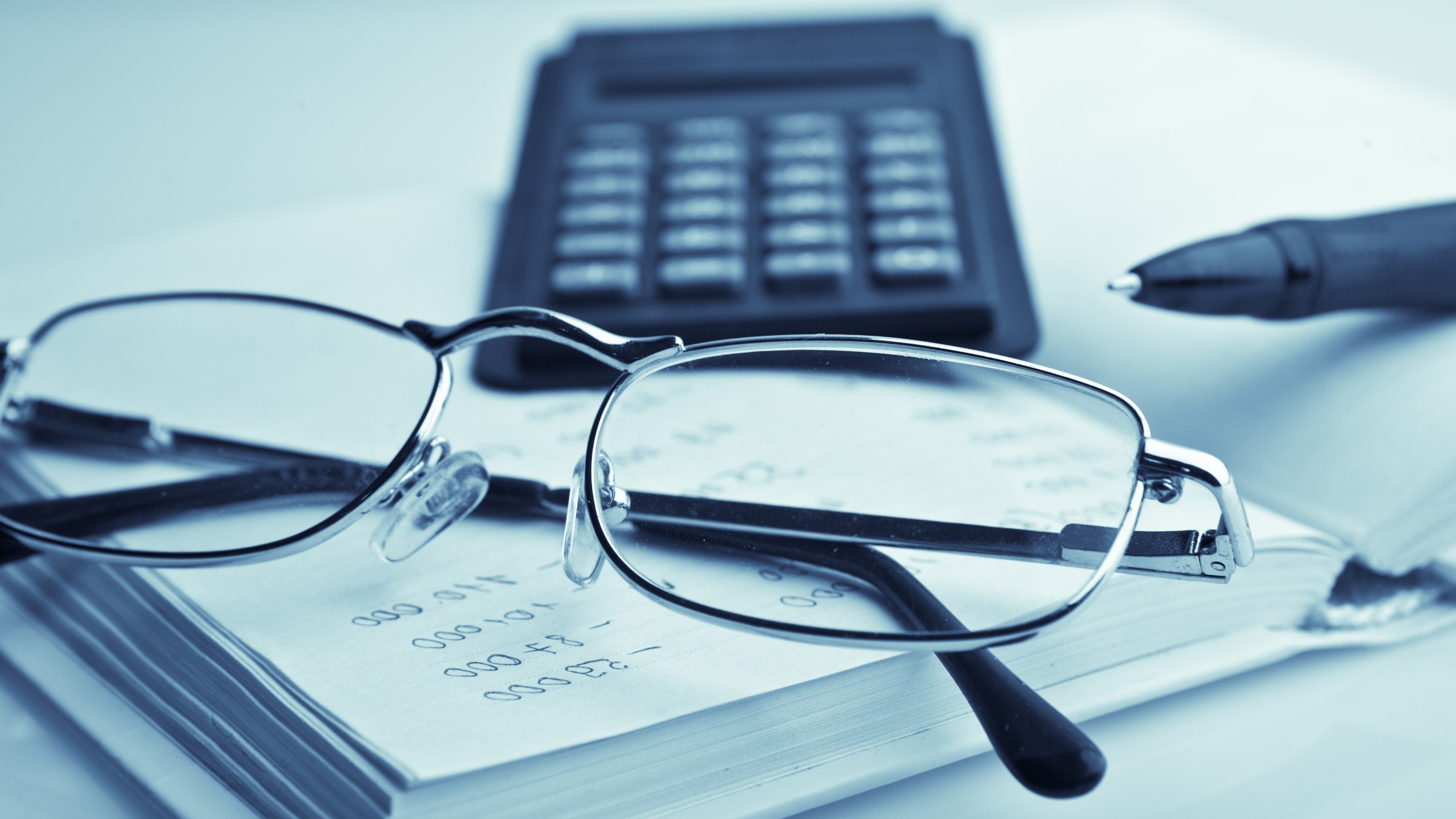 4K Glasses on Book with Calculator and Pen HD Wallpaper