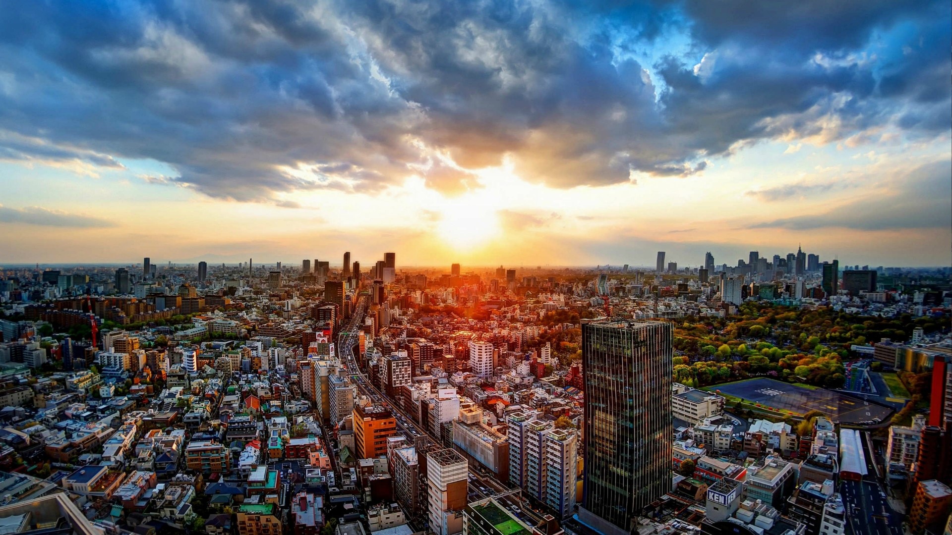 Tokyo Cityscape at Sunset with Dramatic Clouds HD Wallpaper