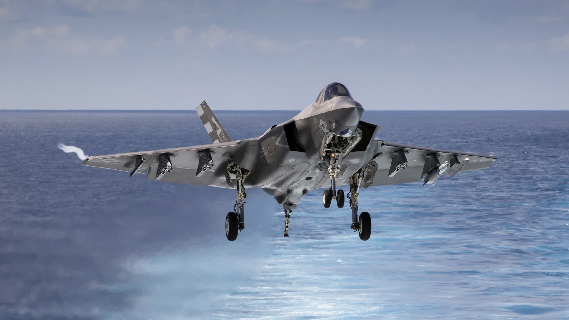 Lockheed Martin F-35 Lightning II fighter jet over ocean HD Wallpaper