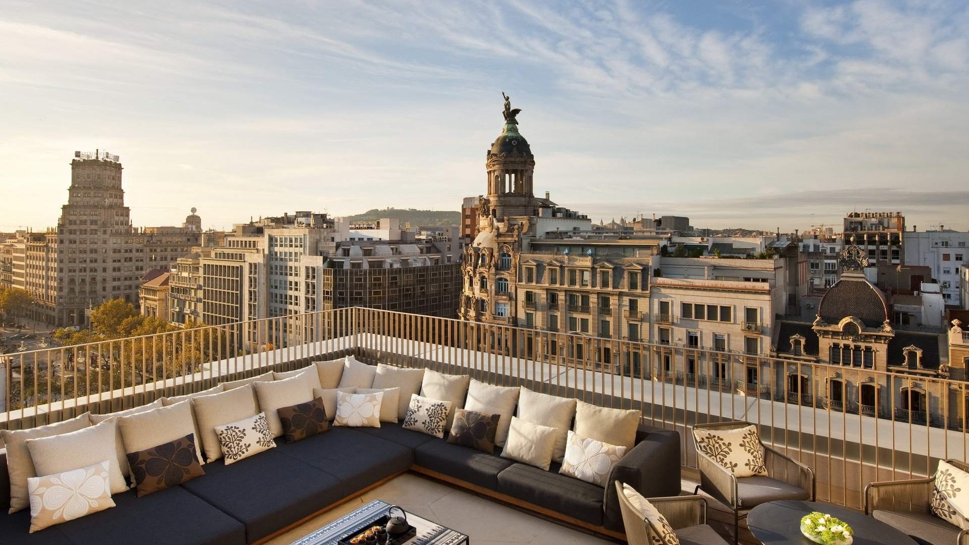 Rooftop terrace overlooking Barcelona cityscape HD Wallpaper