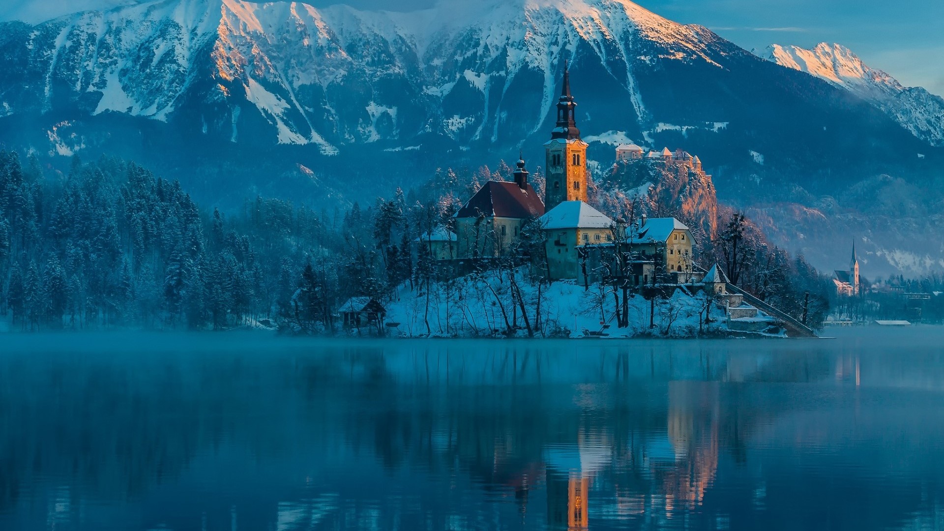 Winter island church and castle with snowy mountains HD Wallpaper