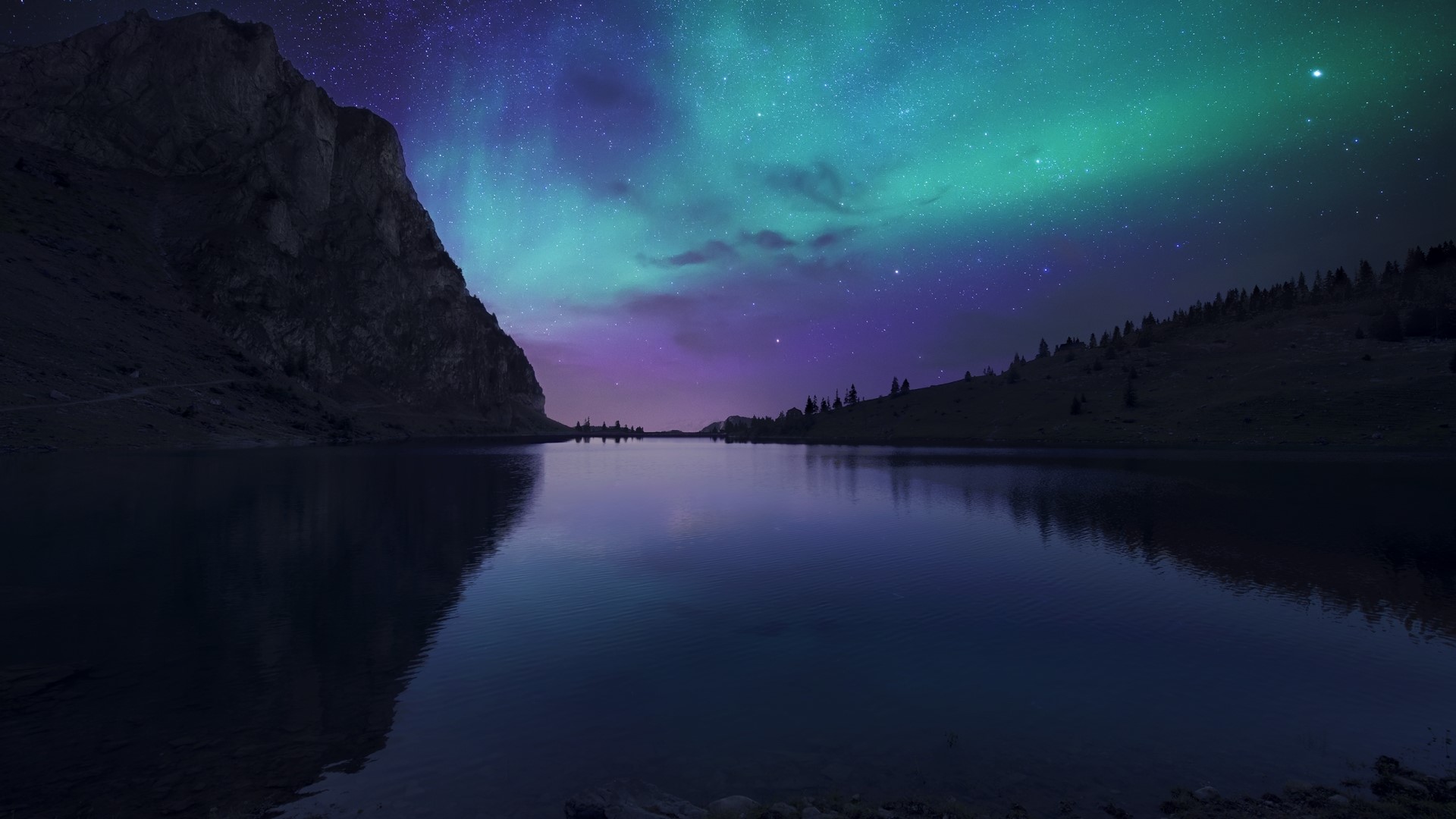 Aurora Borealis over a mountain lake at night HD Wallpaper