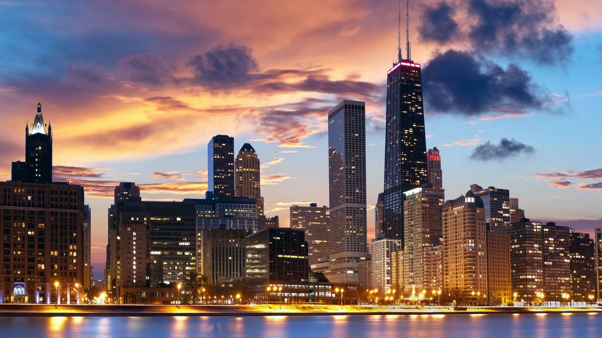 Chicago skyline at sunset with water in foreground HD Wallpaper