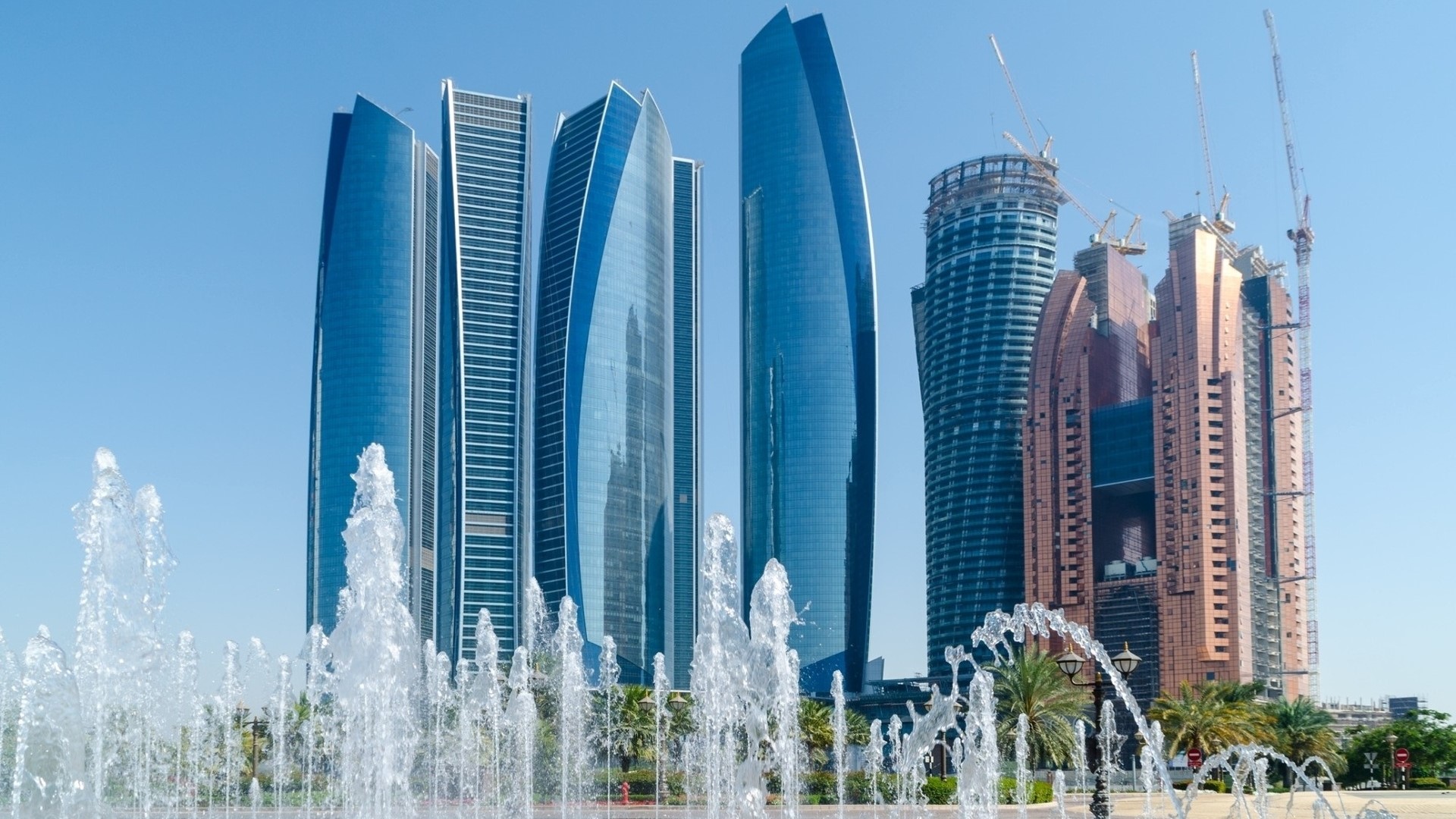 Modern skyscrapers and fountains in Abu Dhabi HD Wallpaper