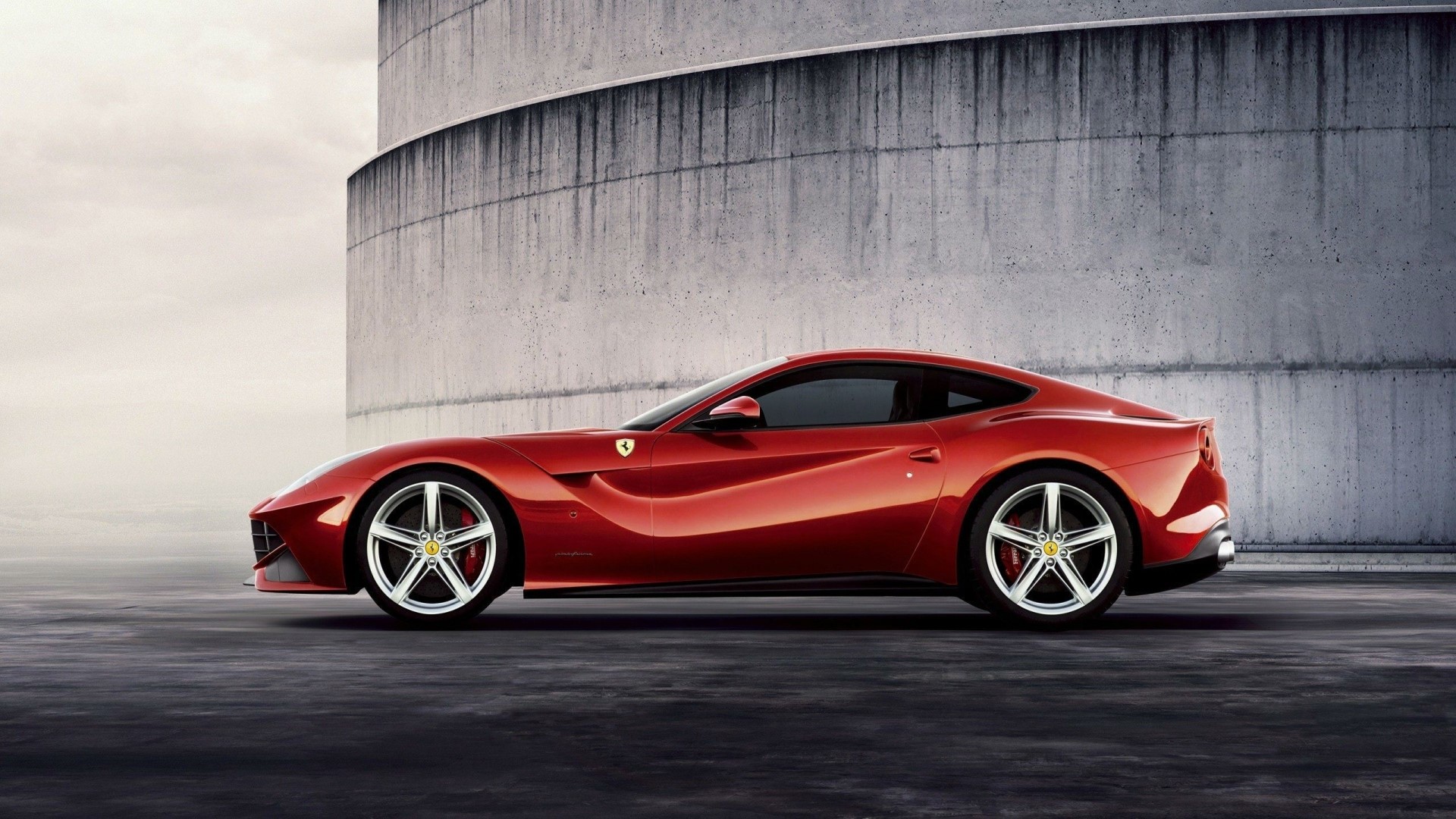 Red Ferrari F12 Berlinetta parked outdoors HD Wallpaper