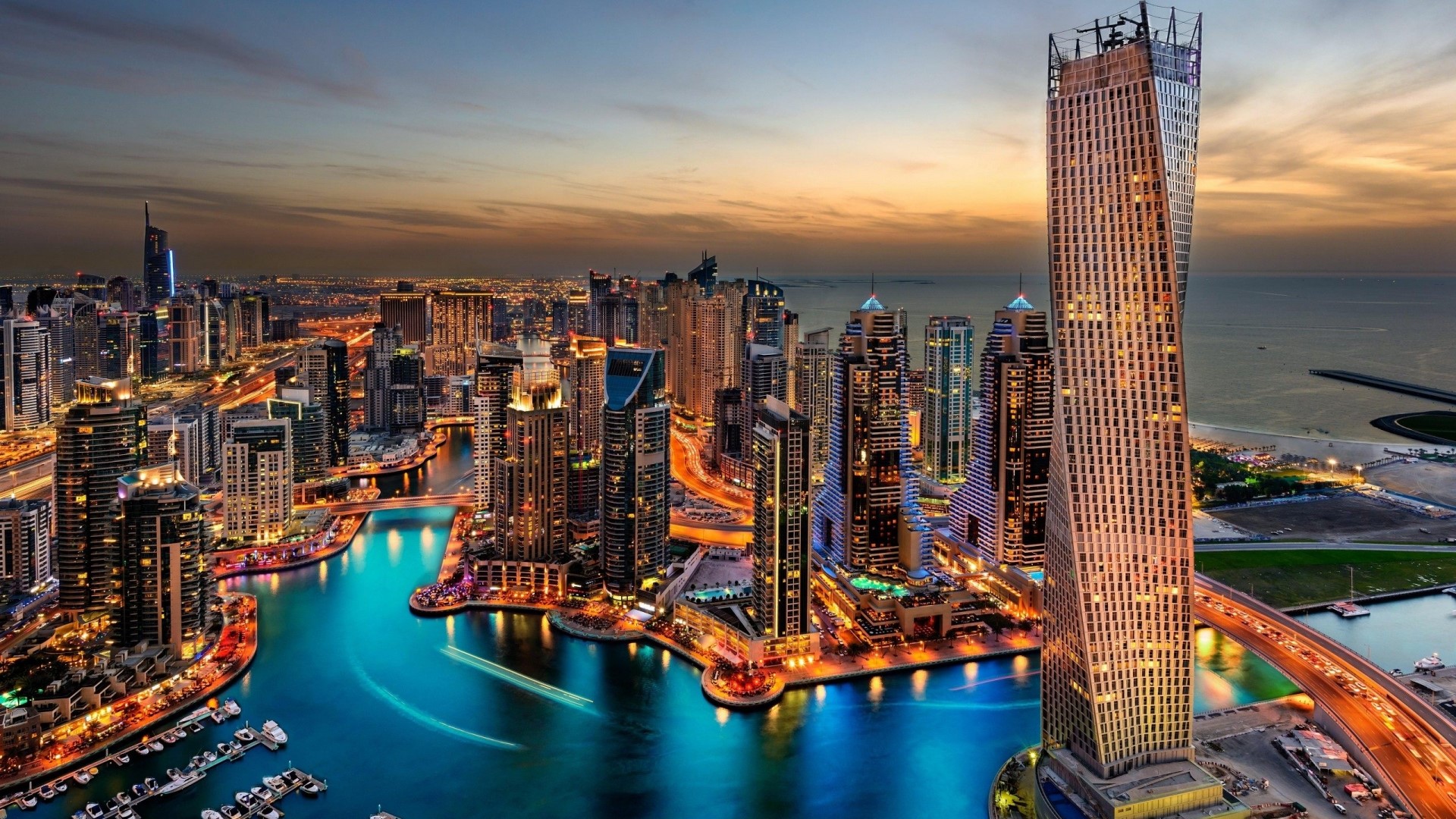 Dubai Marina skyscrapers and waterway at dusk HD Wallpaper