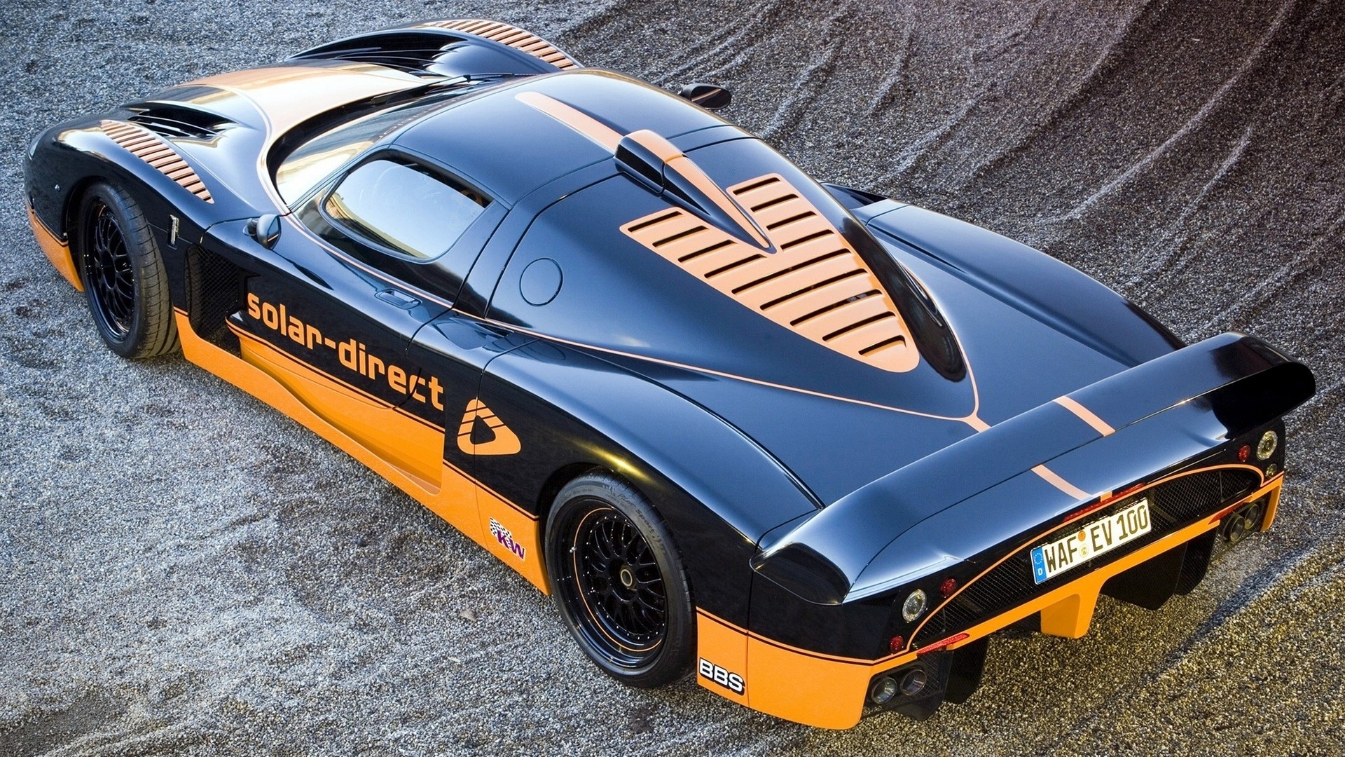 Black and orange solar-direct sports car HD Wallpaper